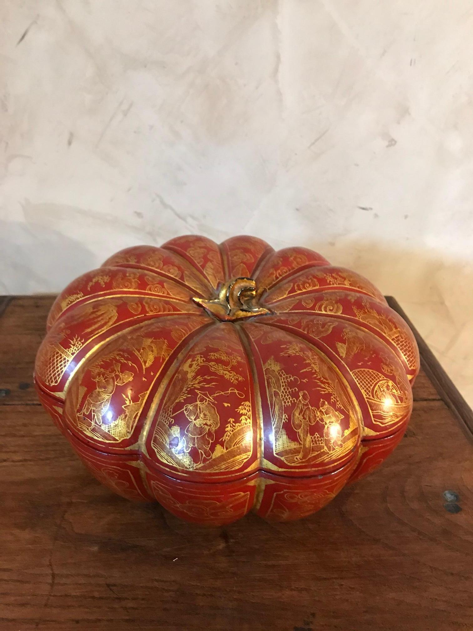 Very nice and original early 20th Chinese paper mâché pumpkin jewelry box from the 1900s. 
Opening top and jewelry compartments tray with blue fabric to keep the jewel protected. 
Chinese gold draws on a red Lacquer. 
Very nice quality. 

 