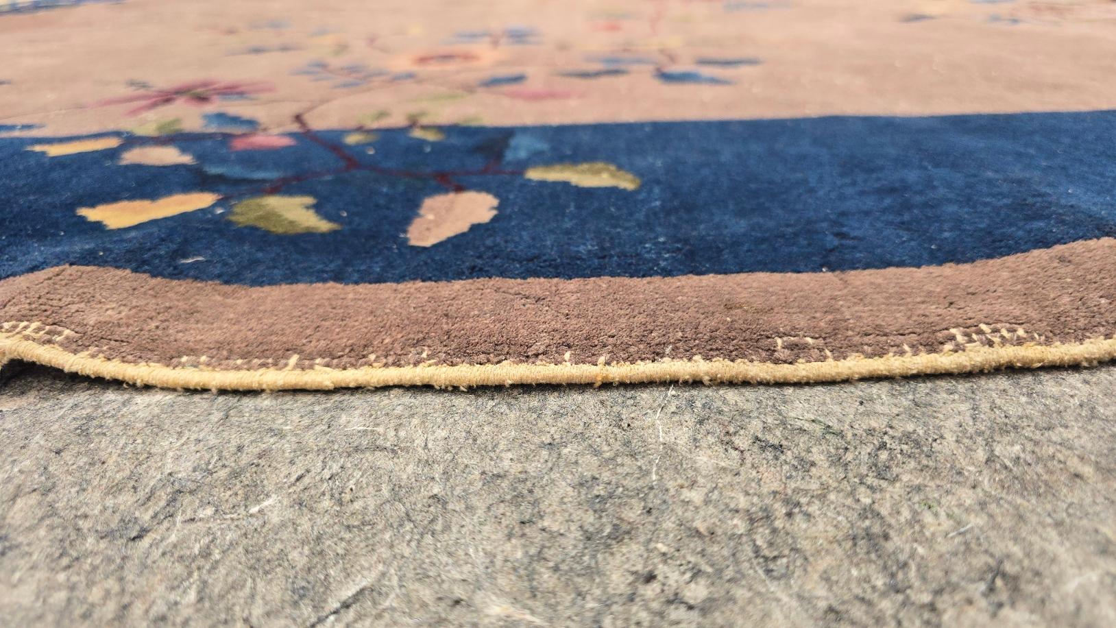 One of a kind !
Art deco Chinese Peking rug with a beautiful pink beige field surrounding a gorgeous floral medallion. Made in the early 1920s from high quality Chinese wool found along the ancient 