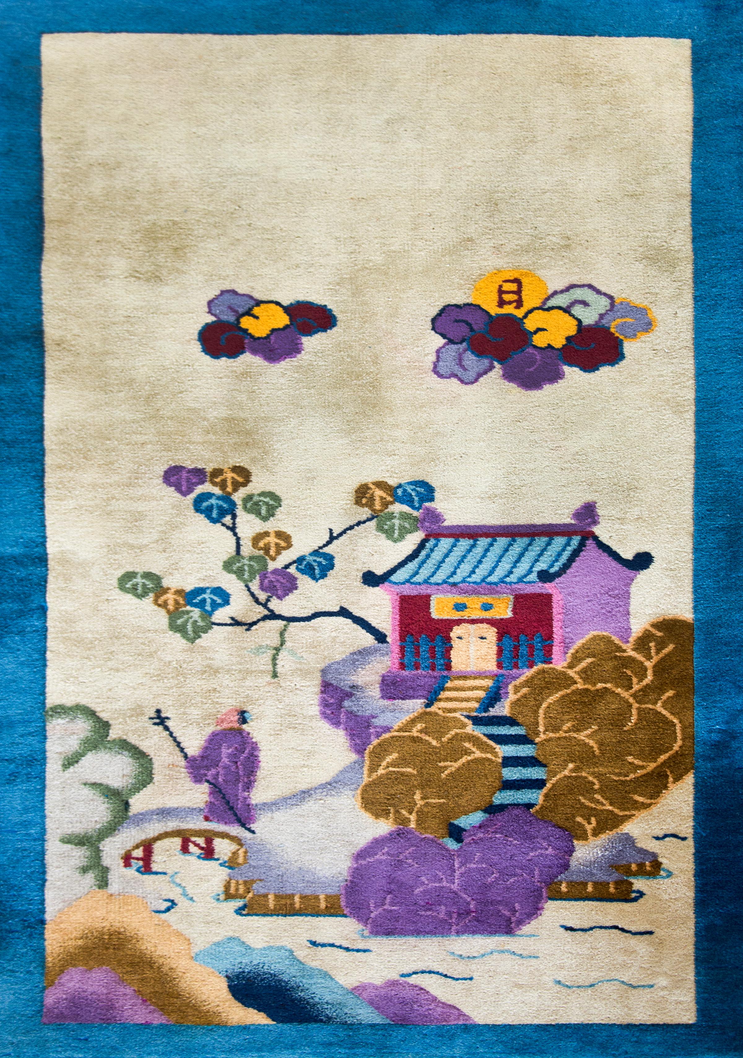 A wonderful early 20th century Chinese pictorial Art Deco rug featuring a scholar's pavilion perched on an outcropping in a garden landscape with a pond in the foreground, a bridge with a scholar gazing at the sky which holds two billowing clouds. 