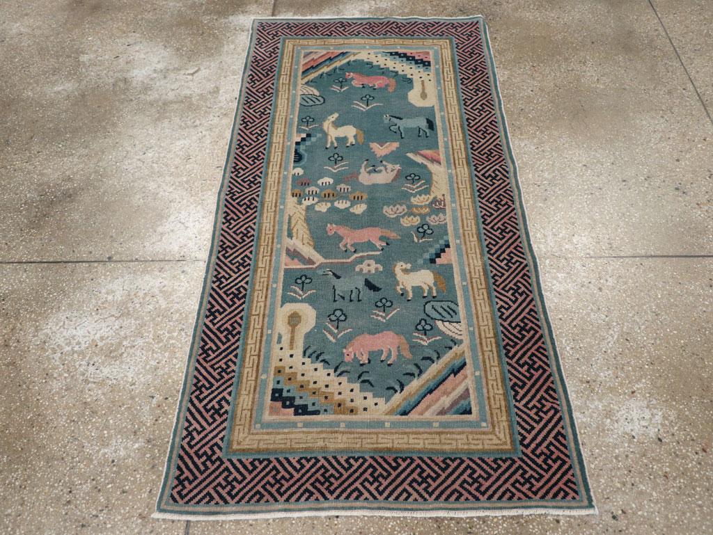 This early 20th century Chinese Peking Art Deco rug, measuring 2' 11