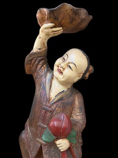 Early 20th Century Chinese Polychrome Carved Wood Boy Statue with Lotus & Peach