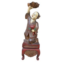 Early 20th Century Chinese Polychrome Carved Wood Boy Statue with Lotus & Peach