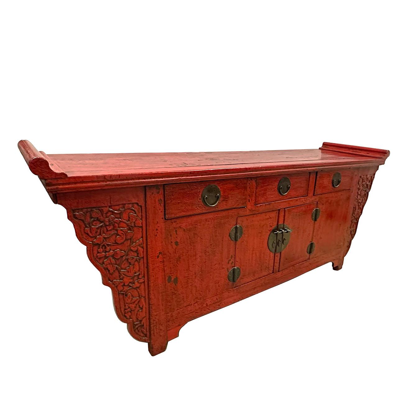 This Chinese Antique Altar Cabinet/Buffet Table was made from solid Elm wood with red lacquered finish and beautiful open carving works on both side. It featured 3 Drawers on the top, Double opening doors cabinet at the front with removable center