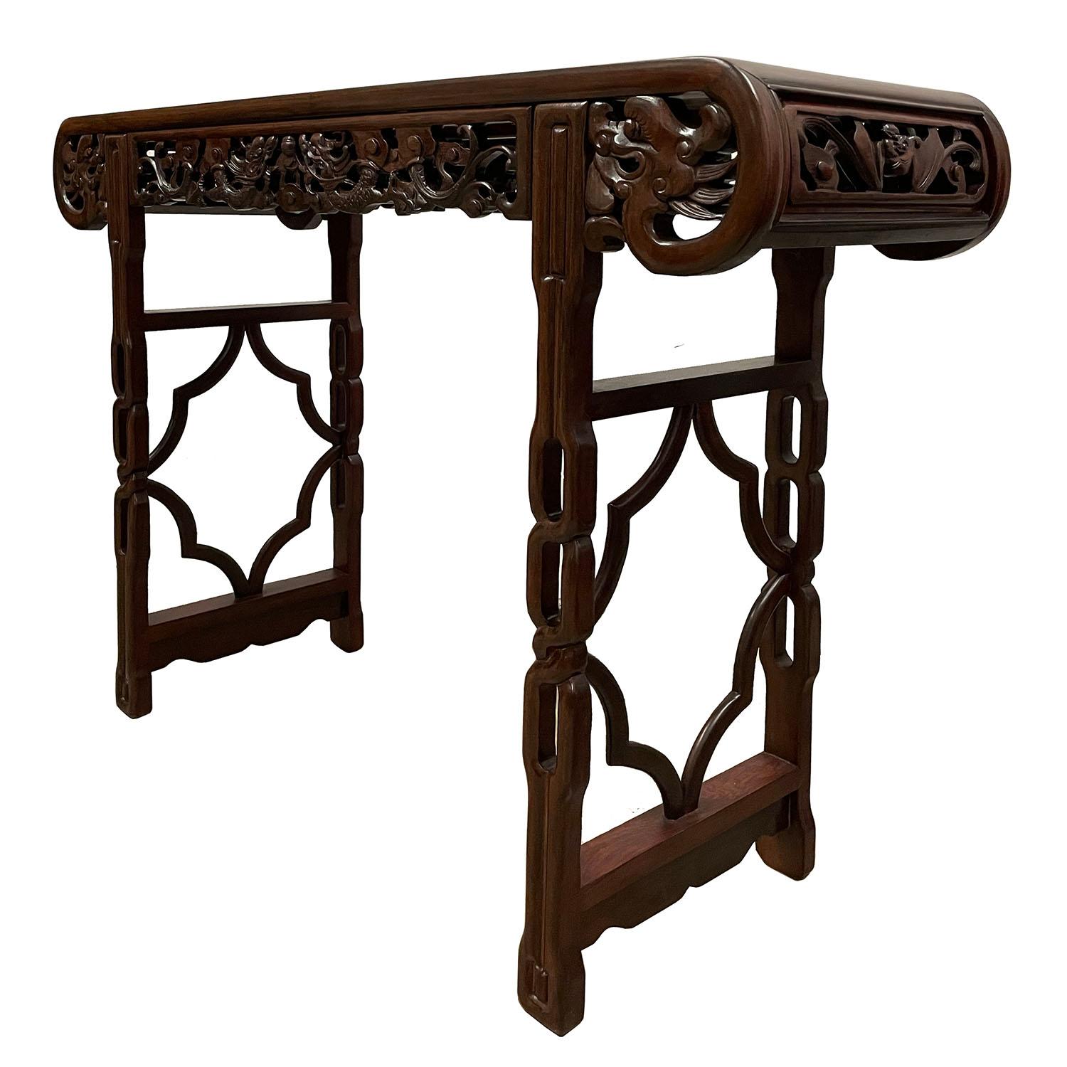 his carved Altar table from China was made from solid Rosewood in about 1900 - 1940's and still maintained very good condition. This table has beautiful open carving works of two dragons playing fire balls on both sides. Very details. Also, there