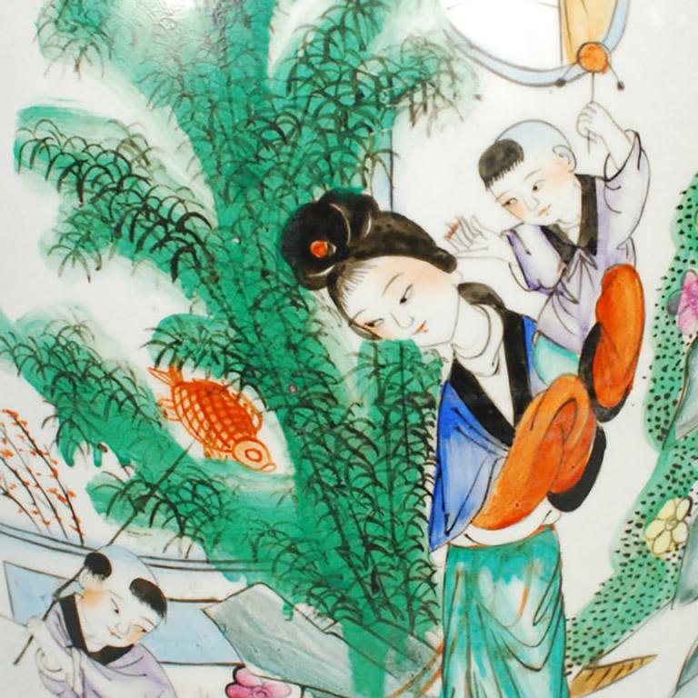 Translated as “After the New Year, spring will begin in Suzhou (China’s garden city),” the beautifully scripted phrase painted at the top of this elegant vase is accompanied by the scene of a wealthy young mother who has brought her children out to