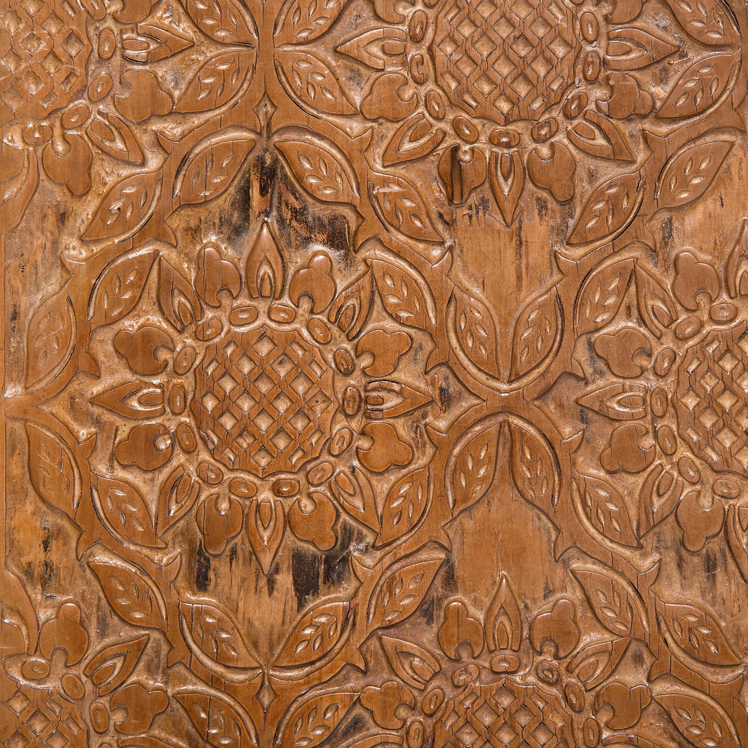 Centuries before Gutenberg's printing press, China was developing and perfecting printing processes that remain popular today. This turn-of-the-century printing block from China's Shanxi province finds new life as a beautifully carved wall
