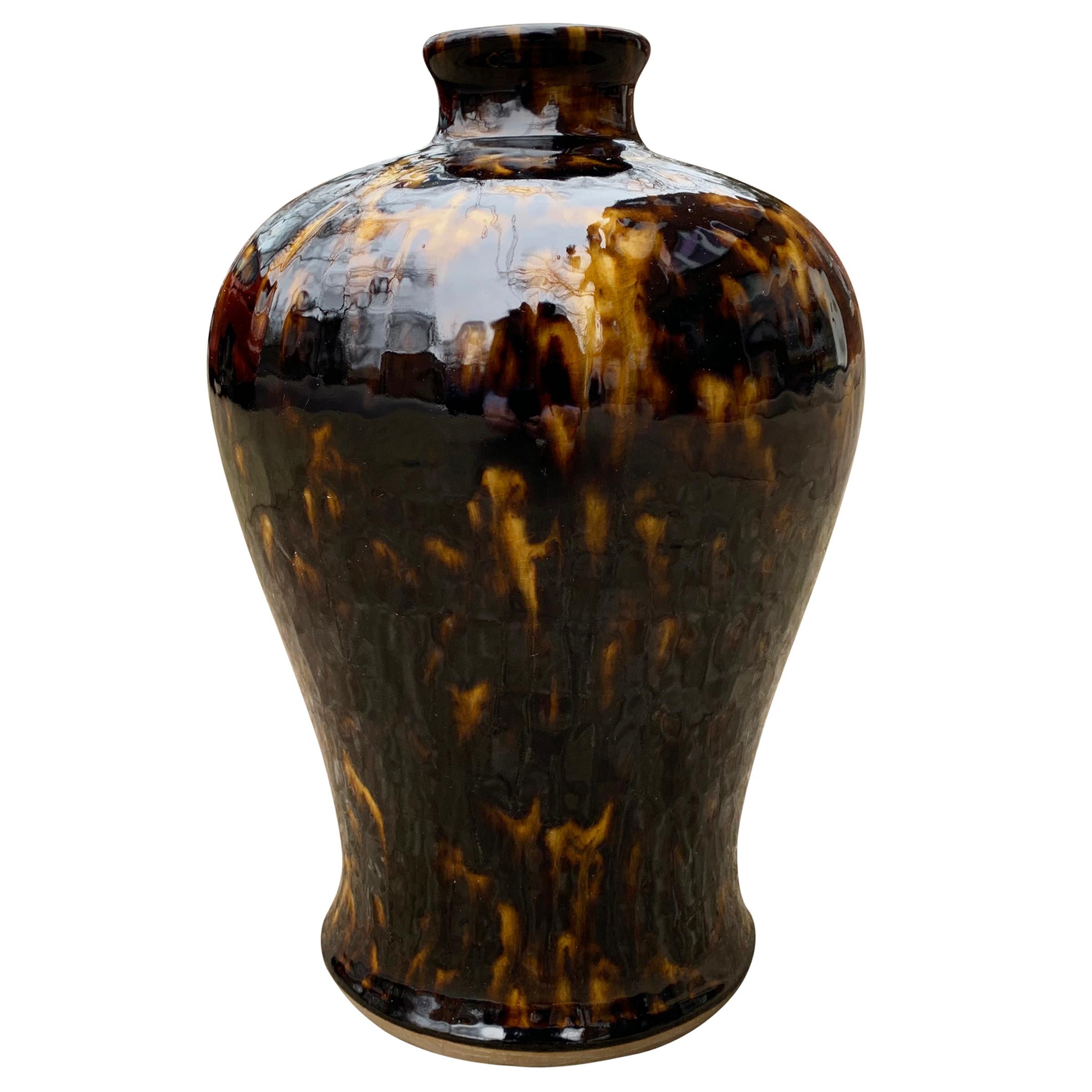 A beautiful early 20th century Chinese Meiping-form vase with a fantastic rich gold and dark brown glaze meant to mimic tortoise shell. Meiping vases are designed to hold a single tall blossoming branch in Spring, hence the narrow neck (to support