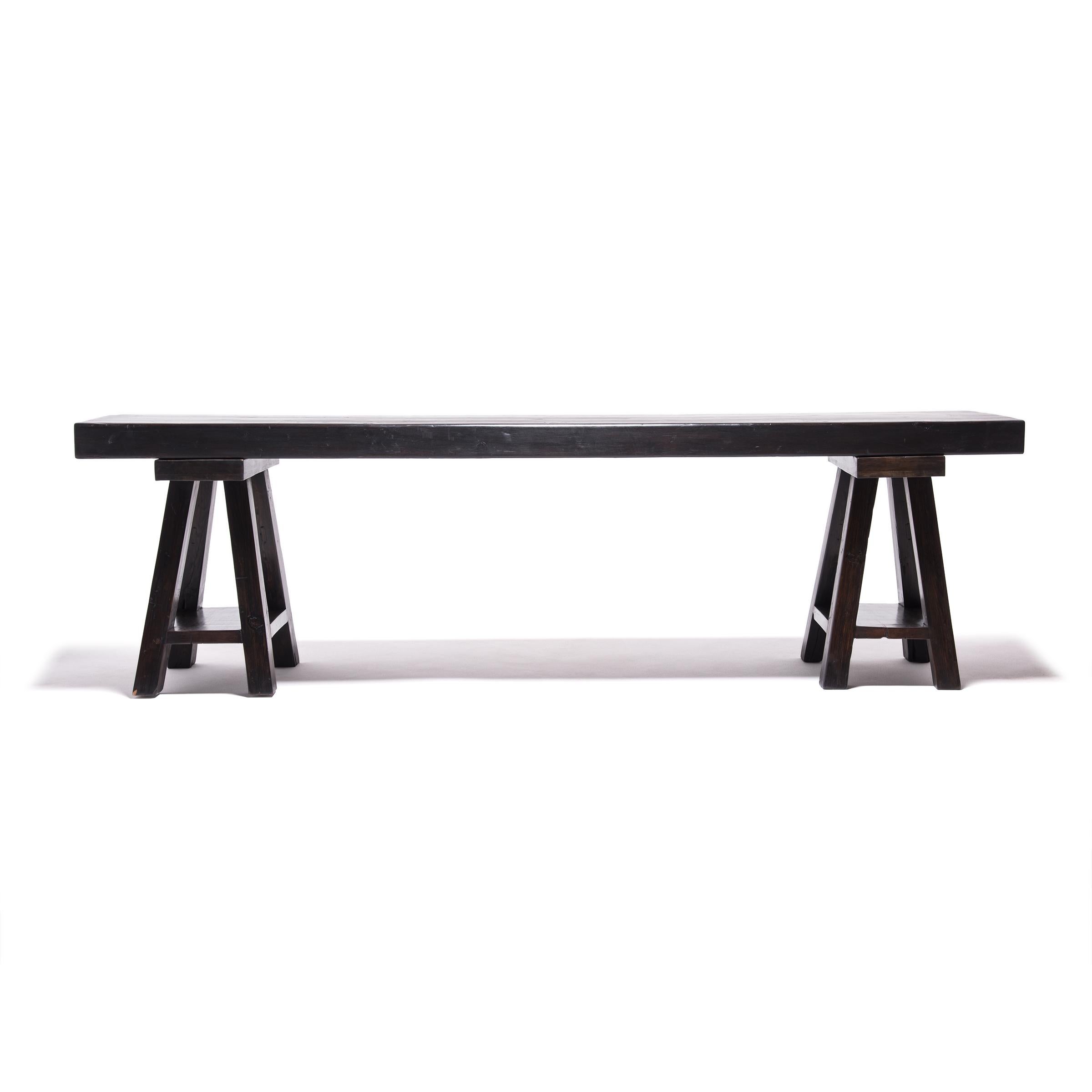 A long, narrow table such as this makes for an ideal workspace for contemplating Chinese scrolls and paintings. This Qing-dynasty table was made in northern China over a century ago, but the timeless, linear design fits effortlessly into the modern