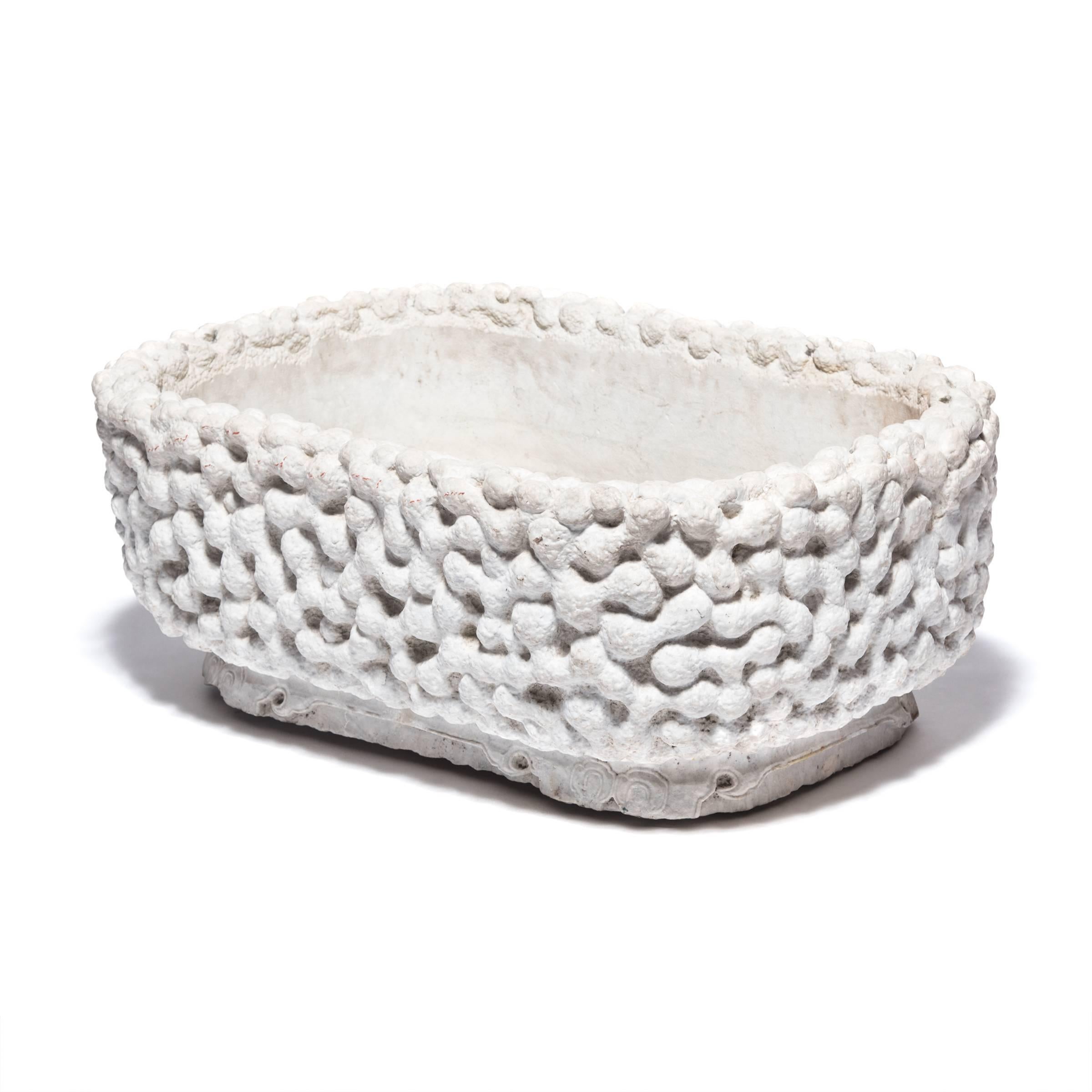 Like a Ming-dynasty scholars' sculptural root objects, this marble basin carved with a gnarled root pattern embraces Daoist affinities with nature and spontaneity. Hand-carved from a single block of white marble, the tub has a rectangular form with