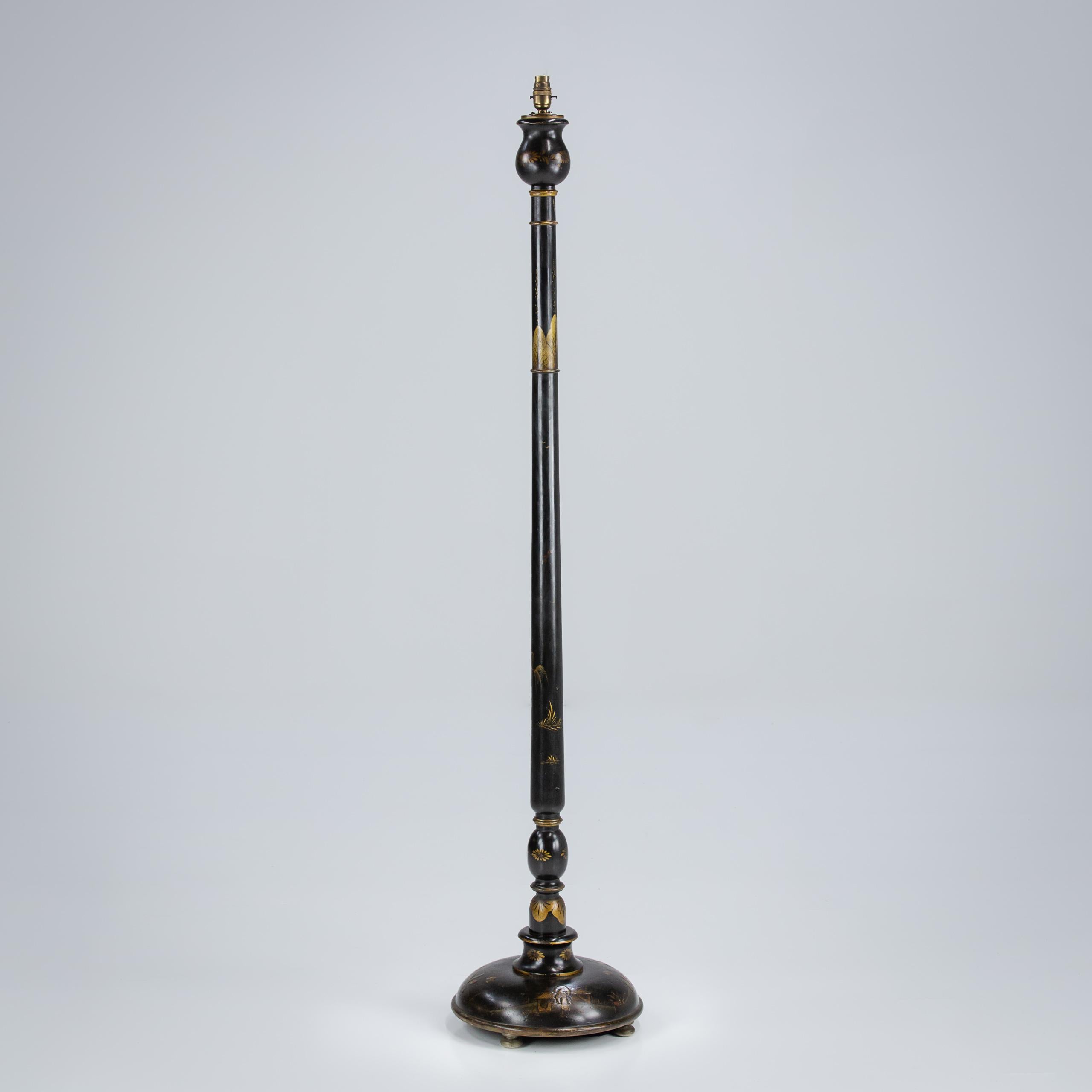 Early 20th Century original ebonised chinoiserie floor standing lamp. Circular turned base on small bun feet with intricate turned and decorated stem. Rewired in antique style flex and PAT tested. England, Circa 1900.