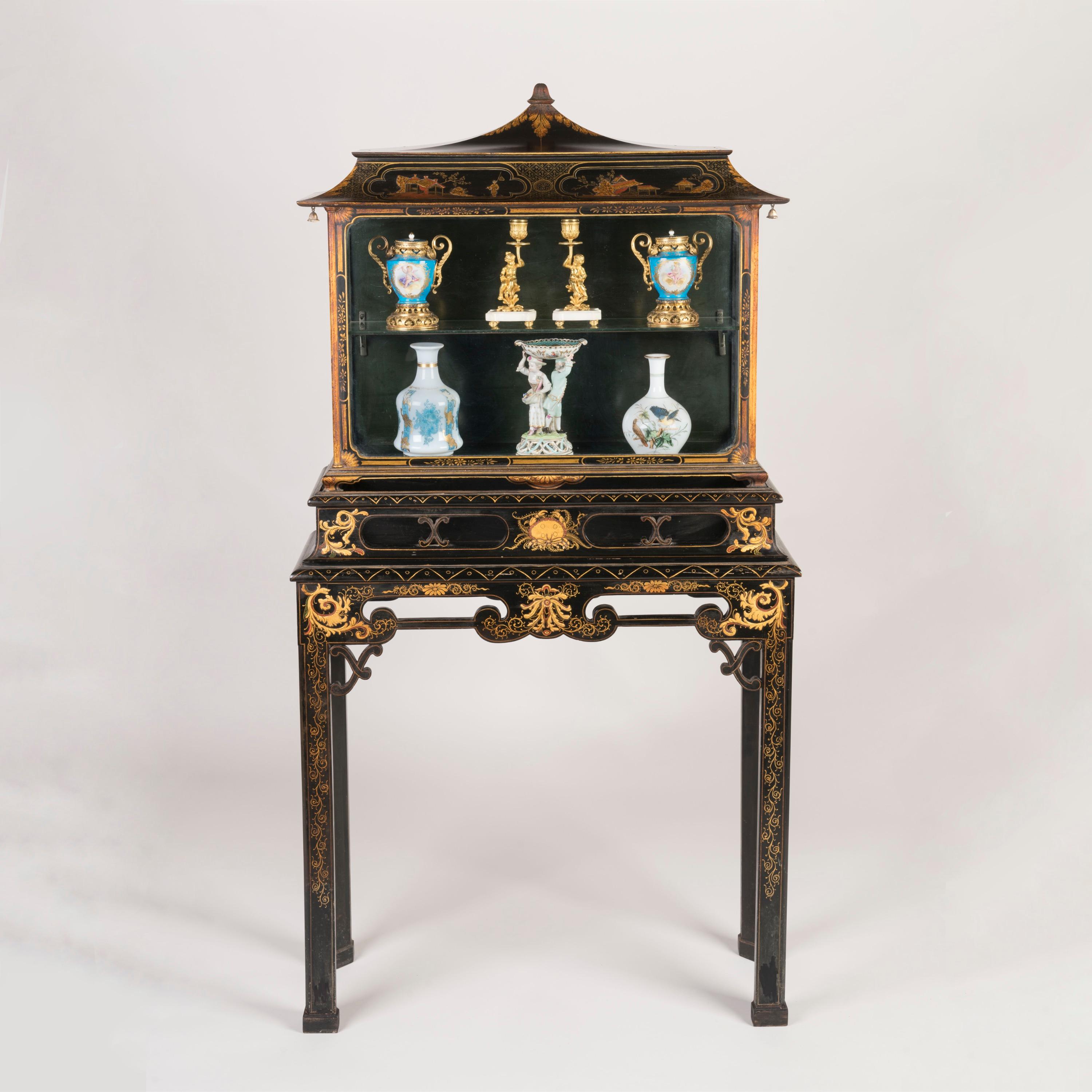A Petite Chinoiserie Lacquered Display Case
Attributed to Hille & Co

A superb example of the lacquered furniture designed and made by Salamon Hille in the early twentieth century, of unusual small proportions, its surface decorated in a black &