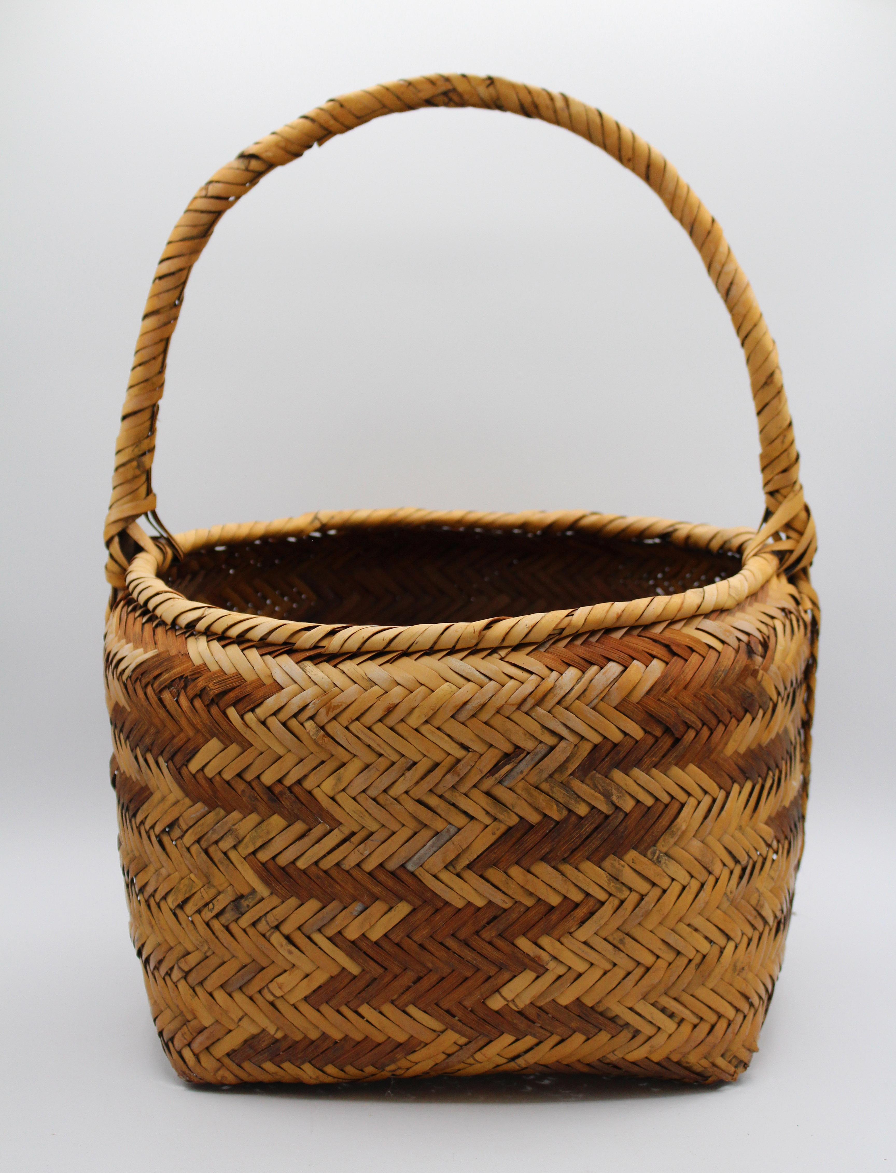Early 20th century Choctaw Native American gathering basket. Various colors of river cane. Very good condition with minor bottom corners with wear & tiny losses commensurate with age & use. Provenance: Estate of Katharine Reid, former director