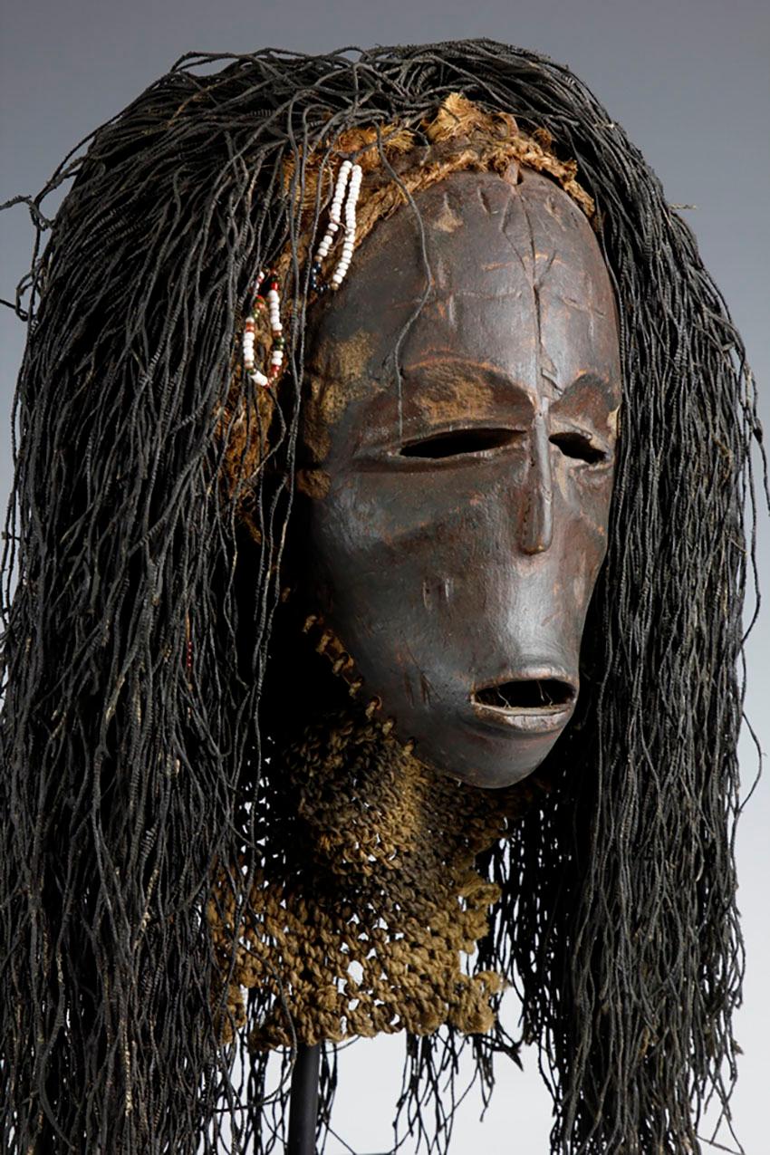 This early twentieth-century Chokwe/Luvale mask, from the border region of Zambia and Angola, displays an amazingly powerful expression. With its high cheekbones and strong, monkey-like jaws, the mask exhibits great primal features. Fine facial