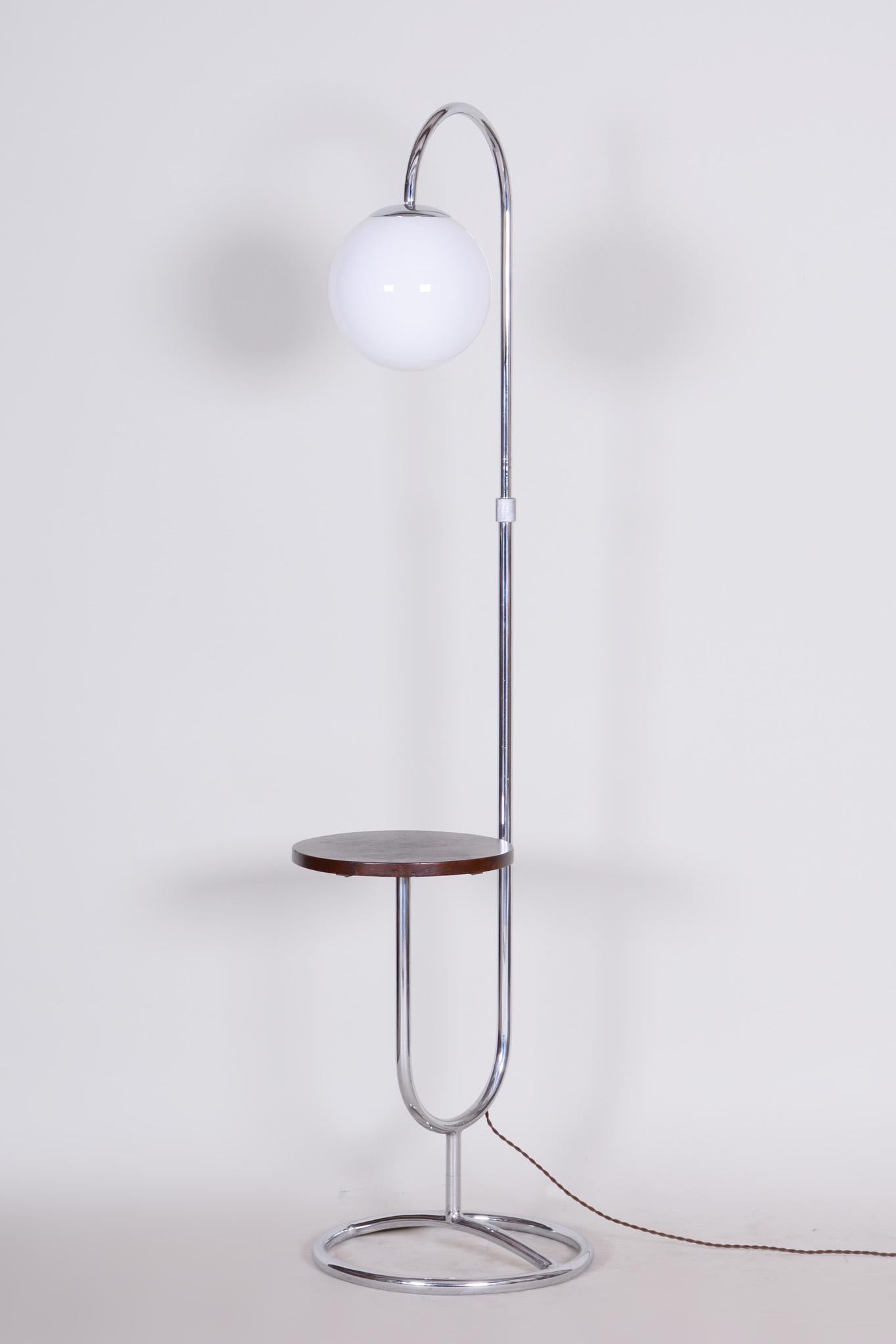 Chrome lamp. European Plug (up to 250V)
New electrification.

Style: Bauhaus.
Period: 1930-1939.
Material: Chrome-plated steel, milk glass
Maker: Hynek Gottwald.