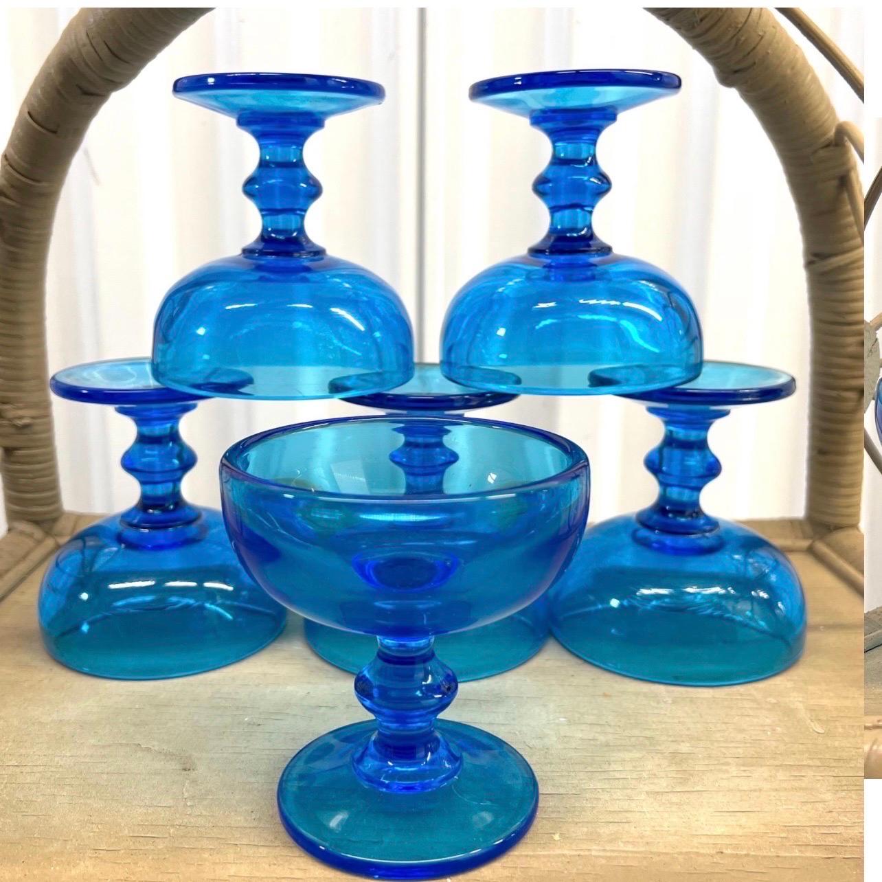 This fantastic set of cobalt blue champagne coupes or dessert glasses are thick and heavy enough for everyday use.  There are actually 7 and I am throwing in the 7th one.  Great color with no chips or cracks.