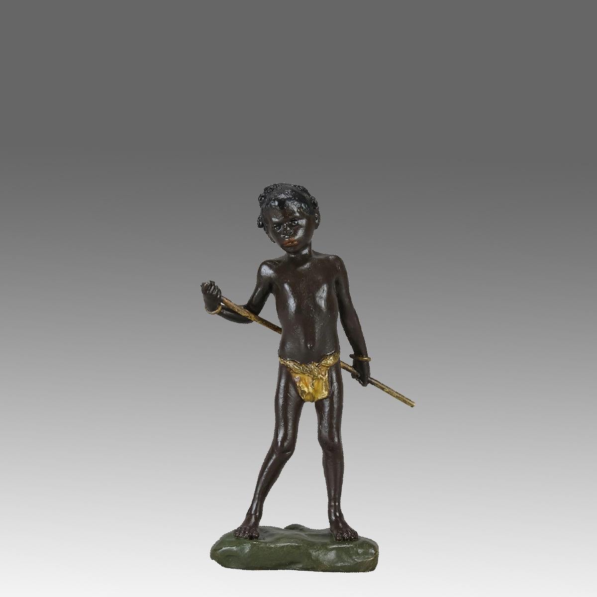A vibrant early 20th Century cold-painted Austrian bronze figure of a young Arab boy holding a staff behind his back with very fine hand chased surface detail and good naturalistic colour, signed with the Bergman 'B' in an amphora vase and inscribed