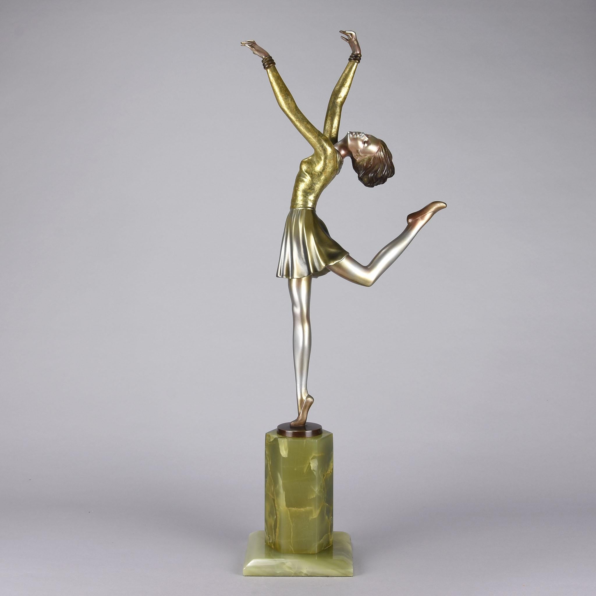 A large and impressive early 20th century Austrian Art Deco bronze figure of a beautiful young dancer in period costume holding an elegant pose. The bronze with very fine cold painted colours and good surface detail, raised on an onyx base and