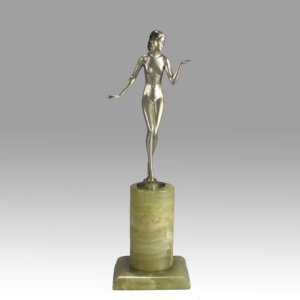 Impressive Austrian cold painted silver bronze figure of a naked Art Deco lady in a questioning pose with one hand out, signed Adolph and raised on a tall cylindrical Brazilian green onyx base.

Provenance: From the magnificent Jackie Collins