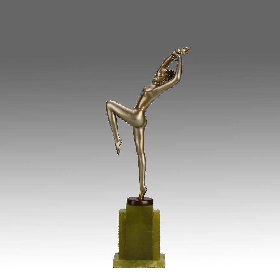 An attractive early 20th Century Art Deco cold painted bronze figure of a young energetic beauty in a dancing pose, exhibiting excellent colour and very fine hand chased surface detail. Raised on a stepped onyx base and signed Lorenzl

ADDITIONAL