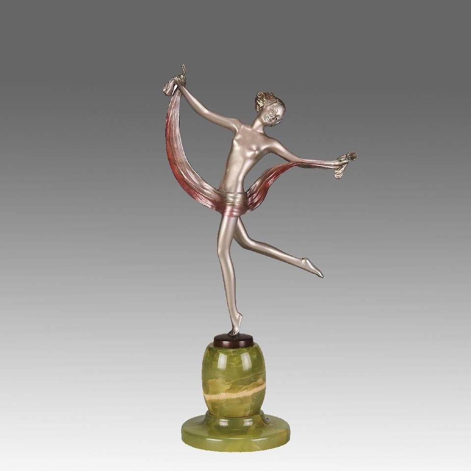 An attractive early 20th Century Art Deco cold painted silver bronze figure of a young energetic beauty in an elegant pose holding a scarf around her midriff, raised on a decorative green onyx base and signed Lorenzl

ADDITIONAL INFORMATION
Height: 