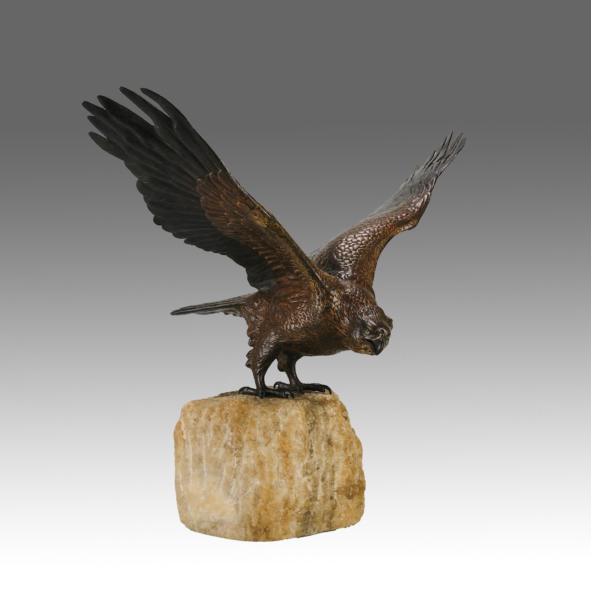 A fabulous early 20th Century Austrian bronze study of an eagle about to take flight with its wings outspread on the edge of a naturalistic rocky outcrop with excellent colour and fine hand finished detail, signed with the Bergman ‘B’ in an amphora