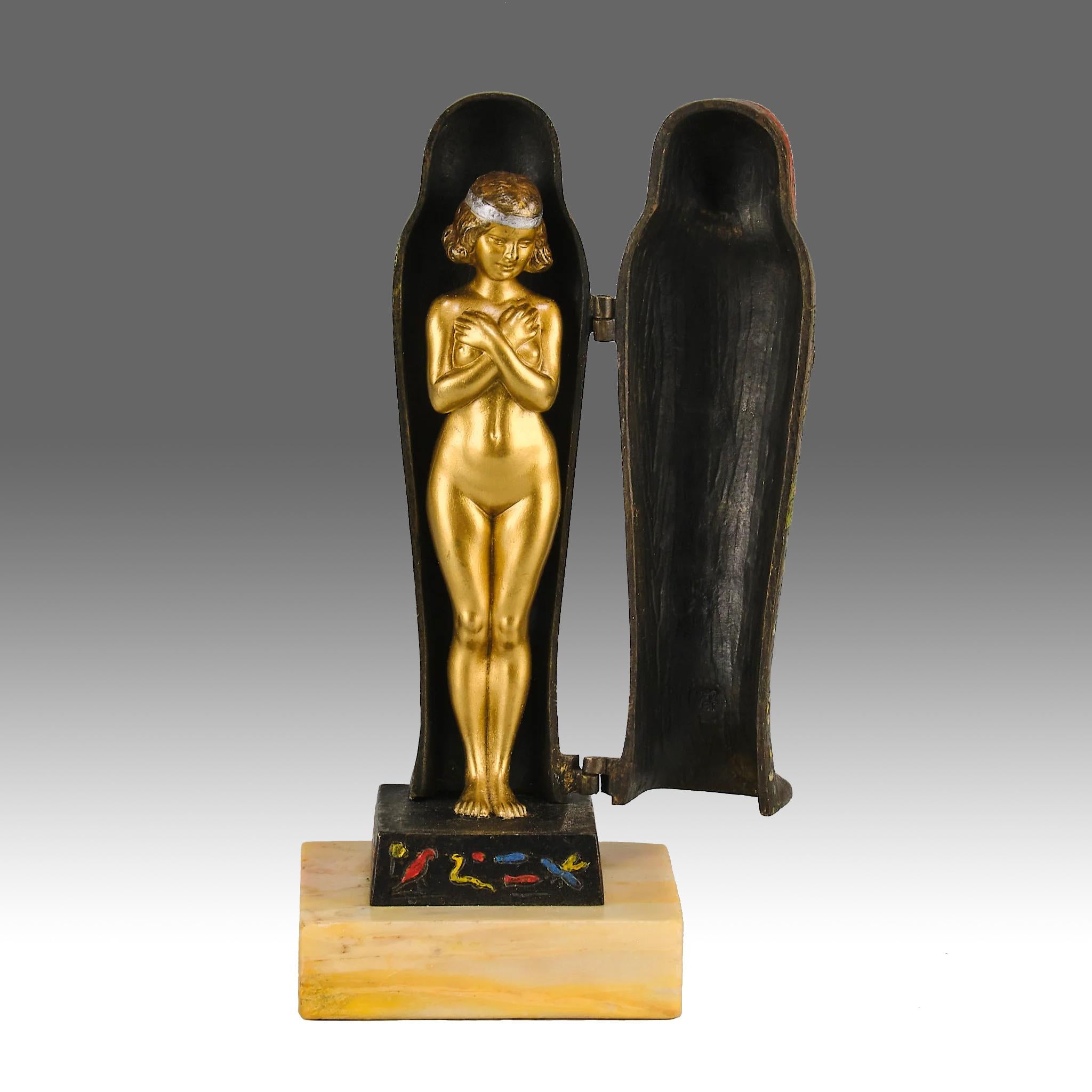 An erotic Austrian cold painted bronze figure of an Egyptian sarcophagus opening to reveal a naked beauty with excellent colour and very fine hand finished detail, signed with the Bergman ‘B’ in an amphora vase

ADDITIONAL INFORMATION
Height:       