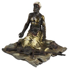 Early 20th Century Cold Painted Bronze Entitled "Seated Arms Dealer" by Bergman