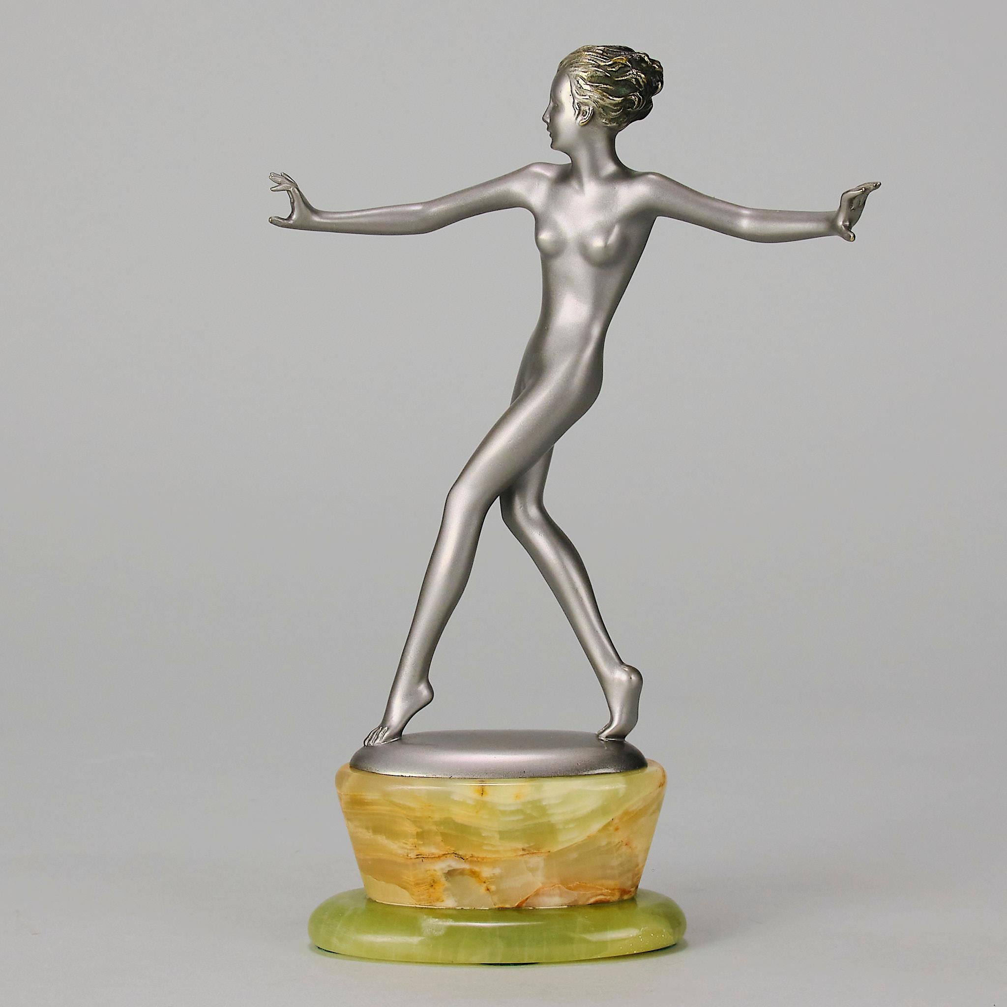 A very fine early 20th Century Art Deco cold painted bronze figure of a naked beauty in the midst of a graceful movement, with excellent colour and fine hand finished detail, raised on a shaped onyx base and signed Lorenzl

ADDITIONAL