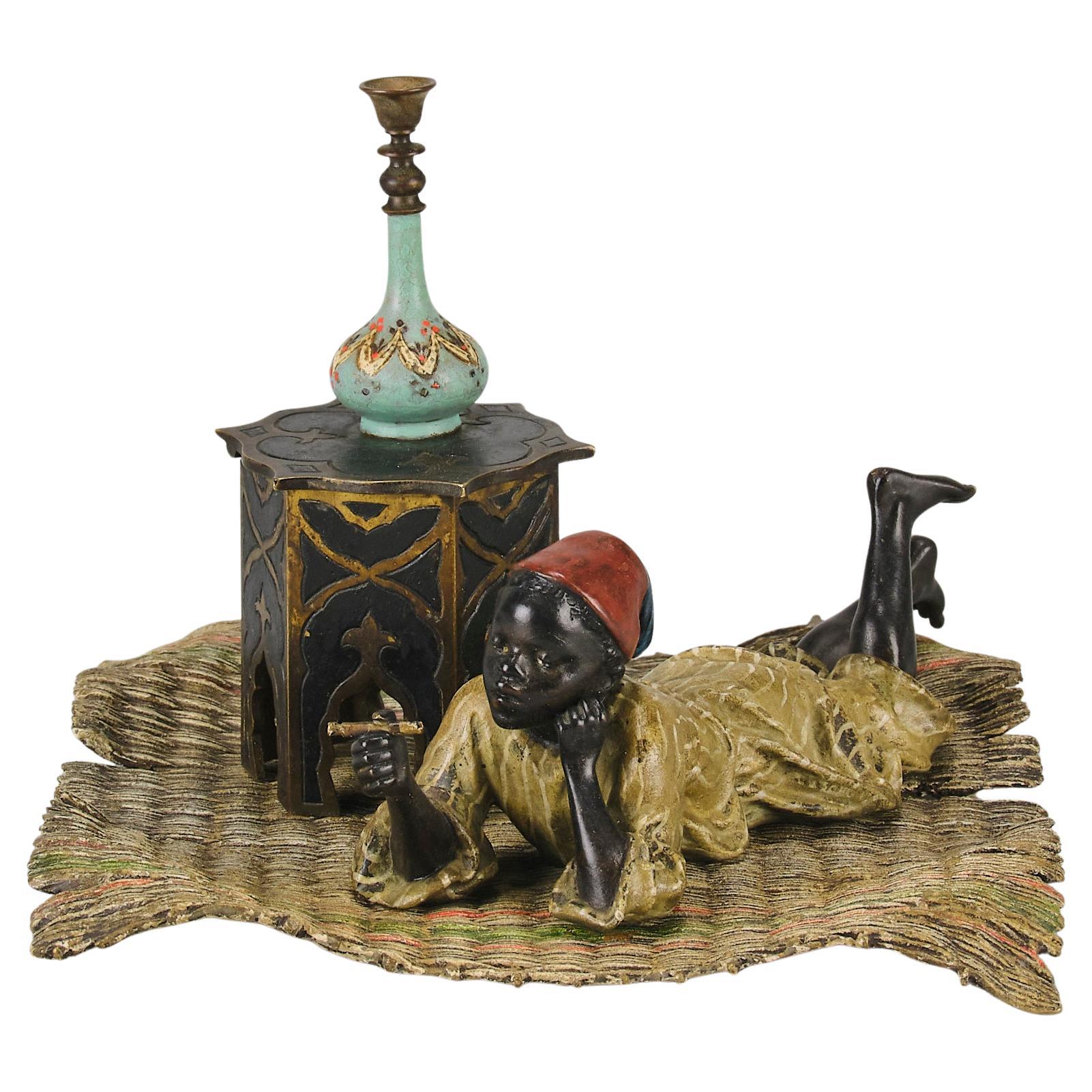 Early 20th Century Cold-Painted Bronze "Reclining Smoking Boy" by Franz Bergman