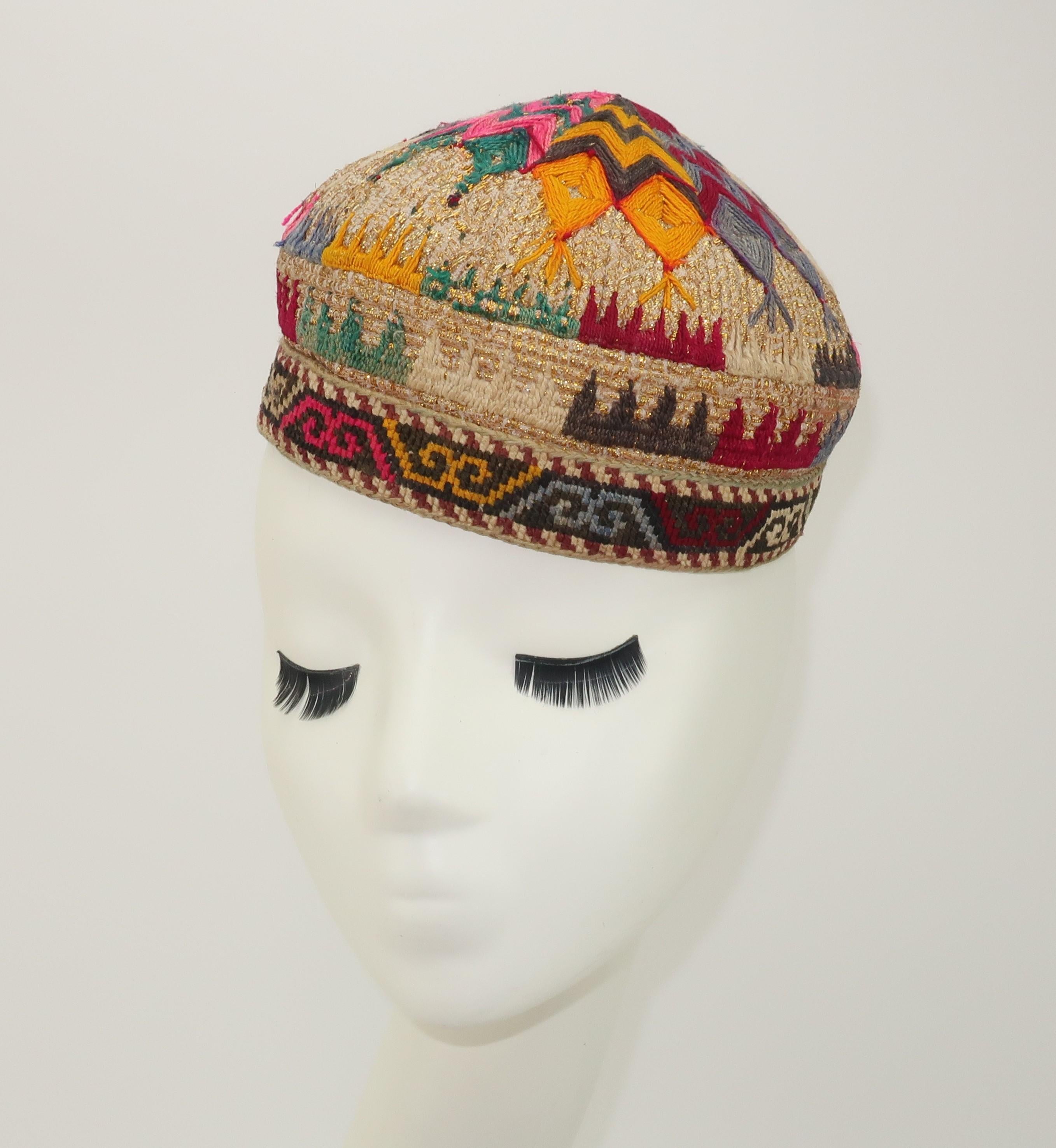 Early 20th Century Central Asian hat, most likely from Uzbekistan, with intricate detailed embroidery accented by gold metallic threading.  The interior is lined with a quilted printed cotton and the brim is decorated with needlework in a geometric