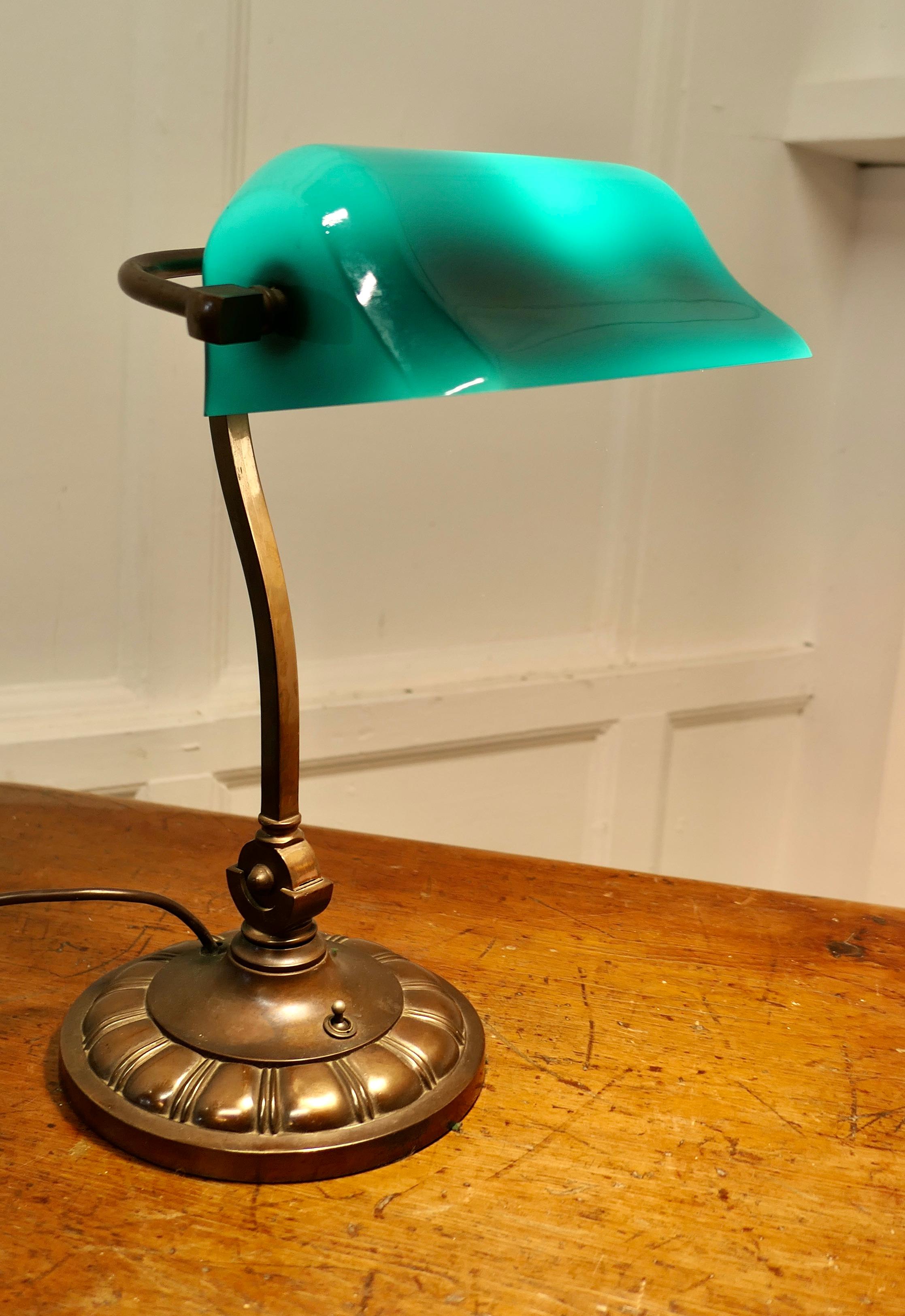 Early 20th Century Copper and Green Glass Barrister’s Desk Lamp

A beautiful and seldom seen heavy quality fully adjustable early vintage barrister’s brass desk lamp, with its original green glass lampshade which has a white reflective underside
The