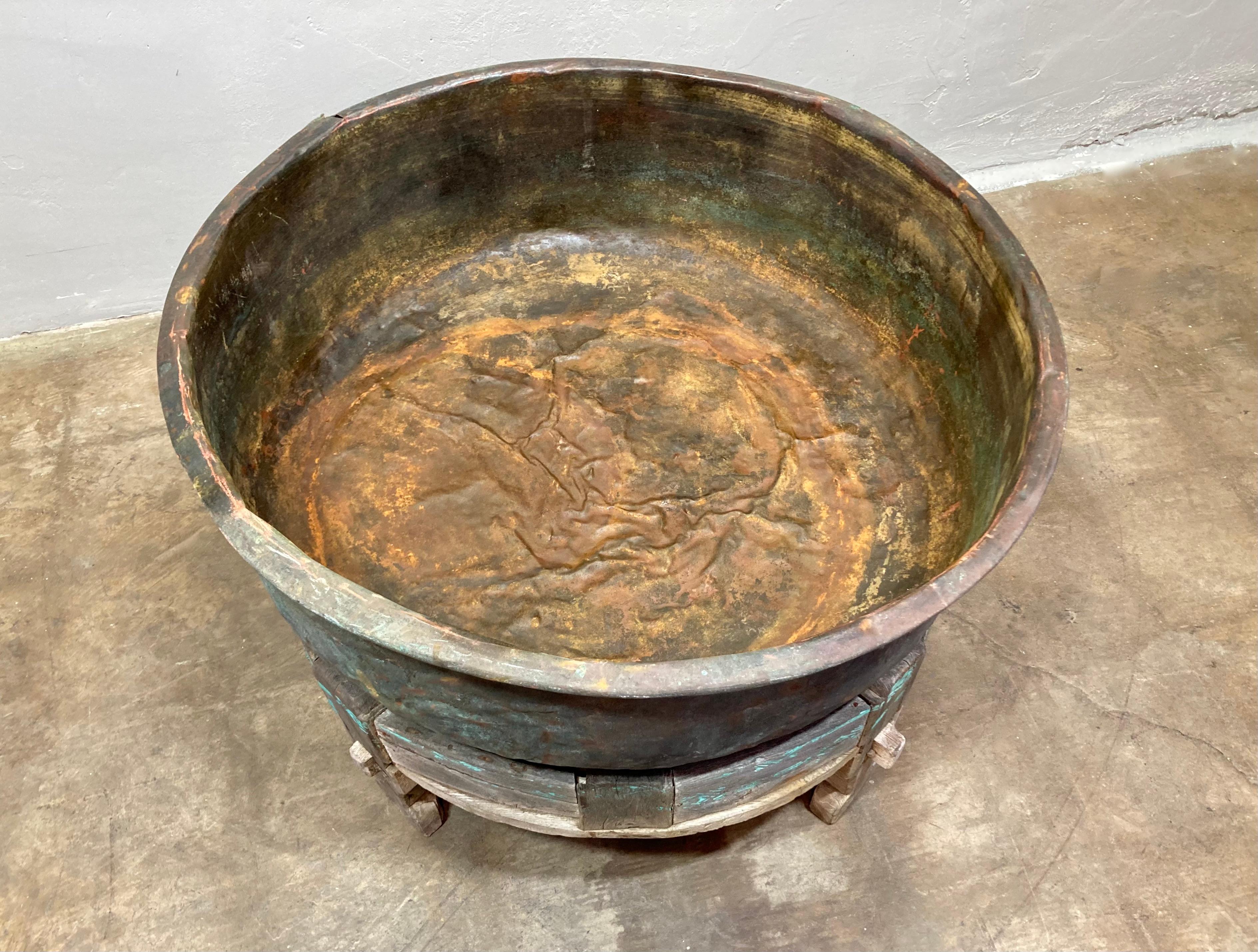 Amazing and rare find! We believe this is an early 20th century copper vat, which was used for aging wheels of cheese. Wooden base is made of teak and features delicate stenciled designs. Great for any who want a piece of history in their home or