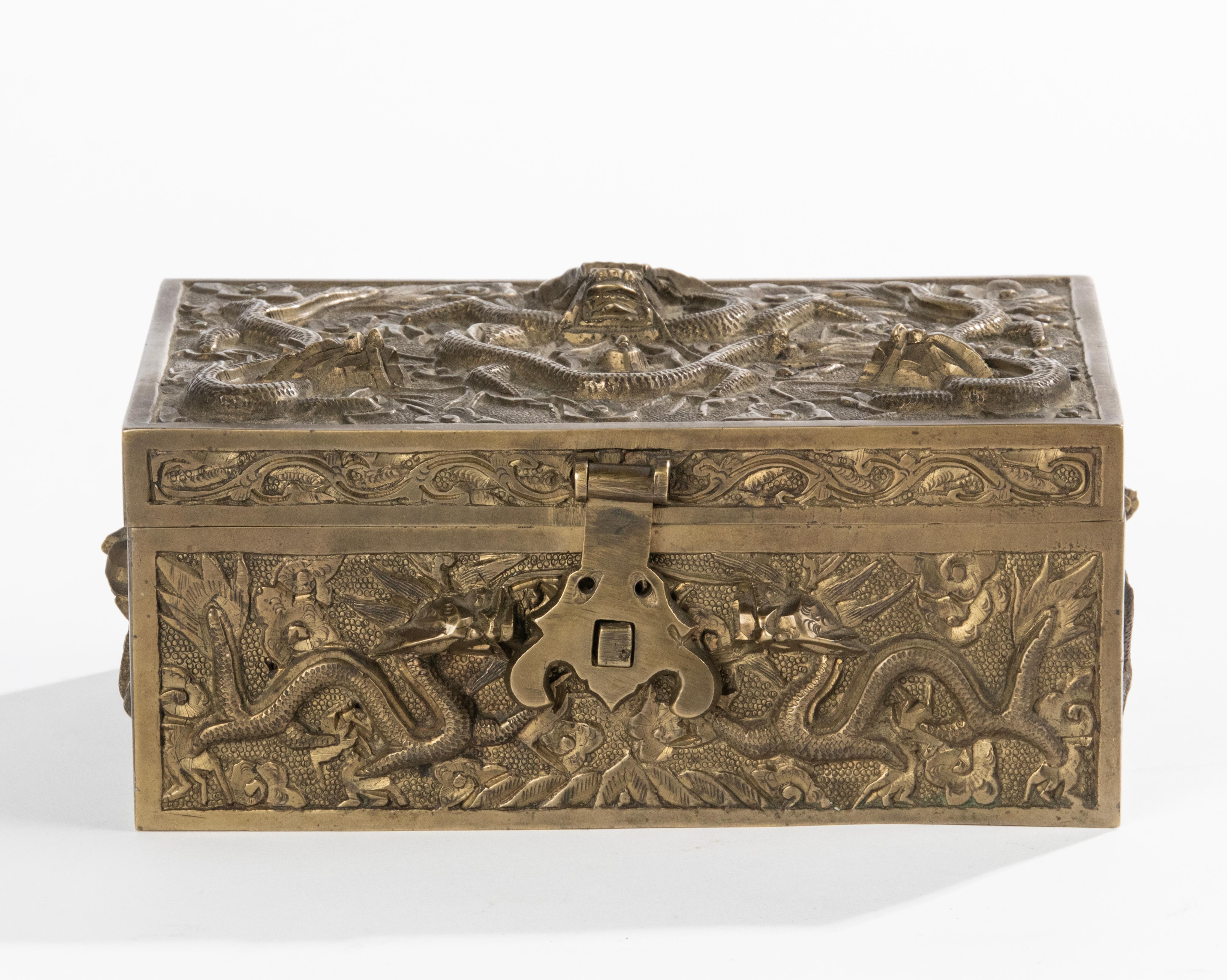 A beautiful copper casted box. Richly decorated with dragons and oriental motifs. The inside is covered with cedar wood, ideal for storage cigars. 
Dimensions: 8(h) x 18 x 12 cm 
The box is in good condition. Nice old patina. 
Free shipping worldwide