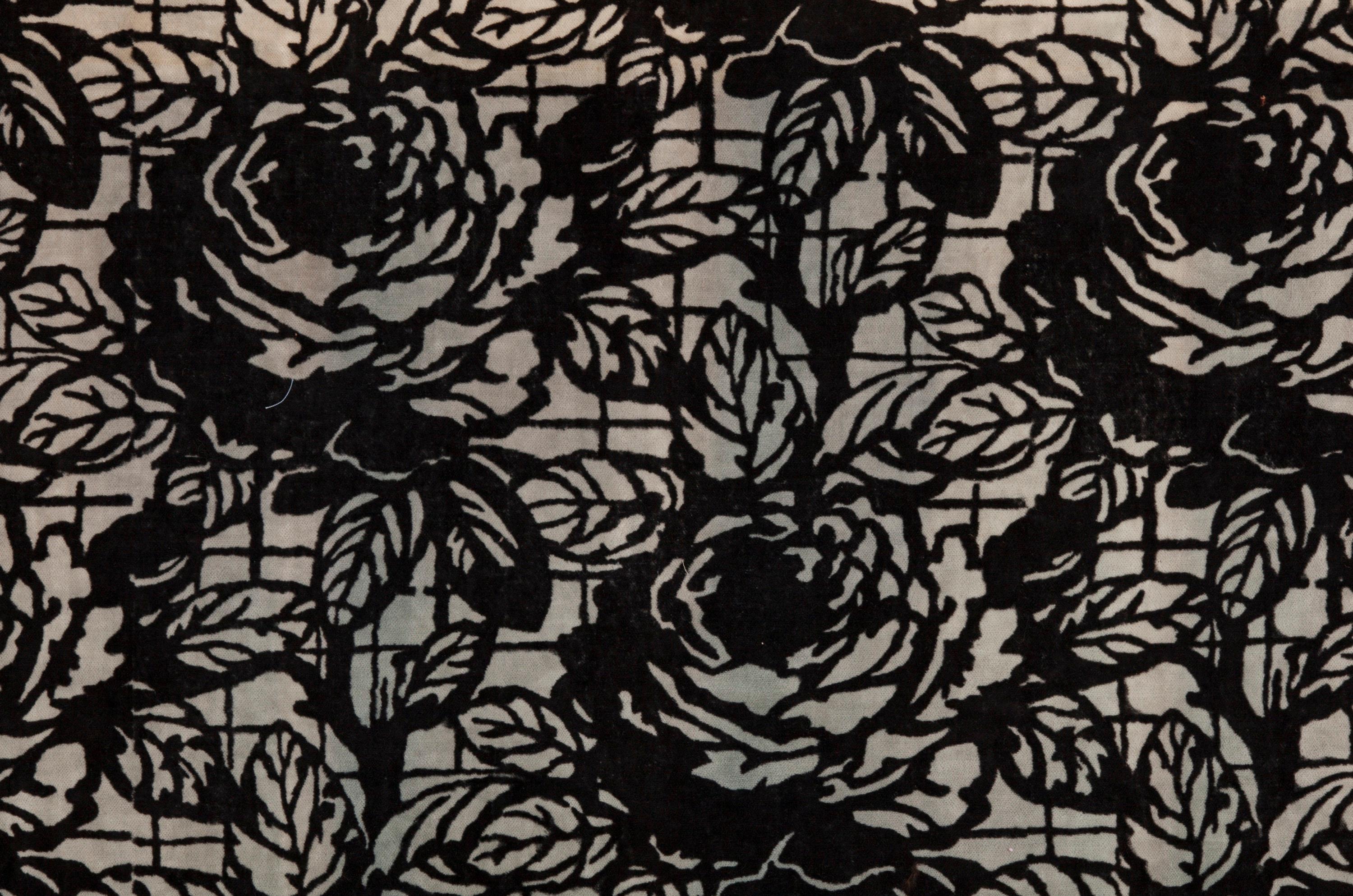 Print cotton velveteen furnishing fabric of stylized offset pattern of roses, diagonally disposed. Note that the textile, which is composed of three sections, has been folded in the primary listing image.