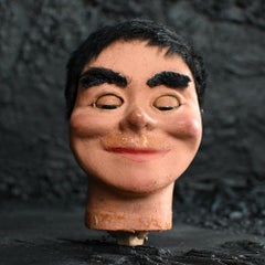 Early 20th century Creepy Glass Eyed English puppet head.