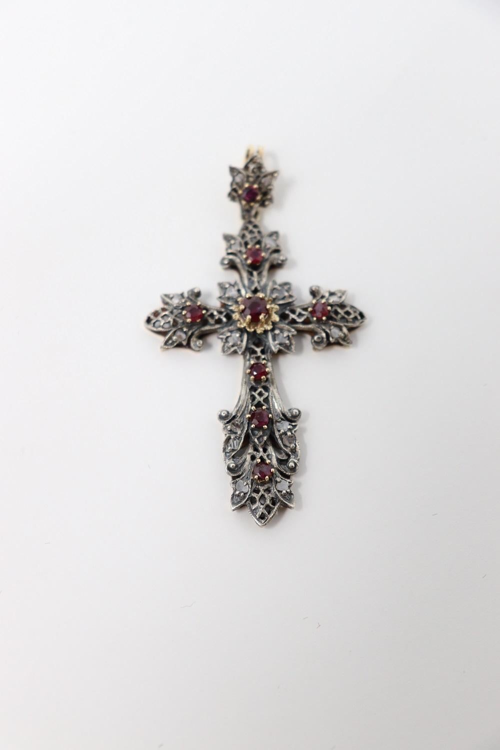 gold cross with rubies
