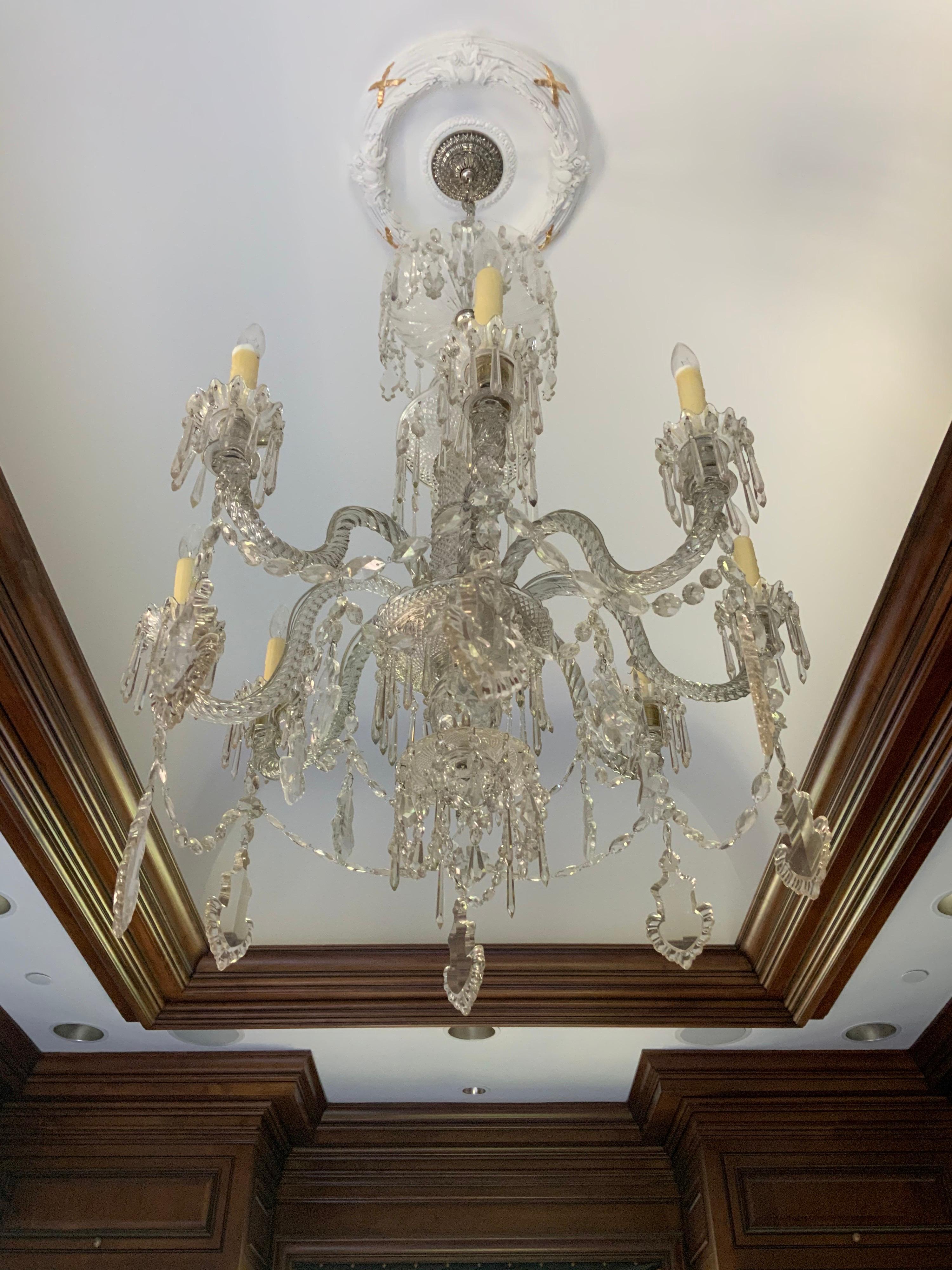 This crystal chandelier with 8 lights origins from France, circa 1920.

 
