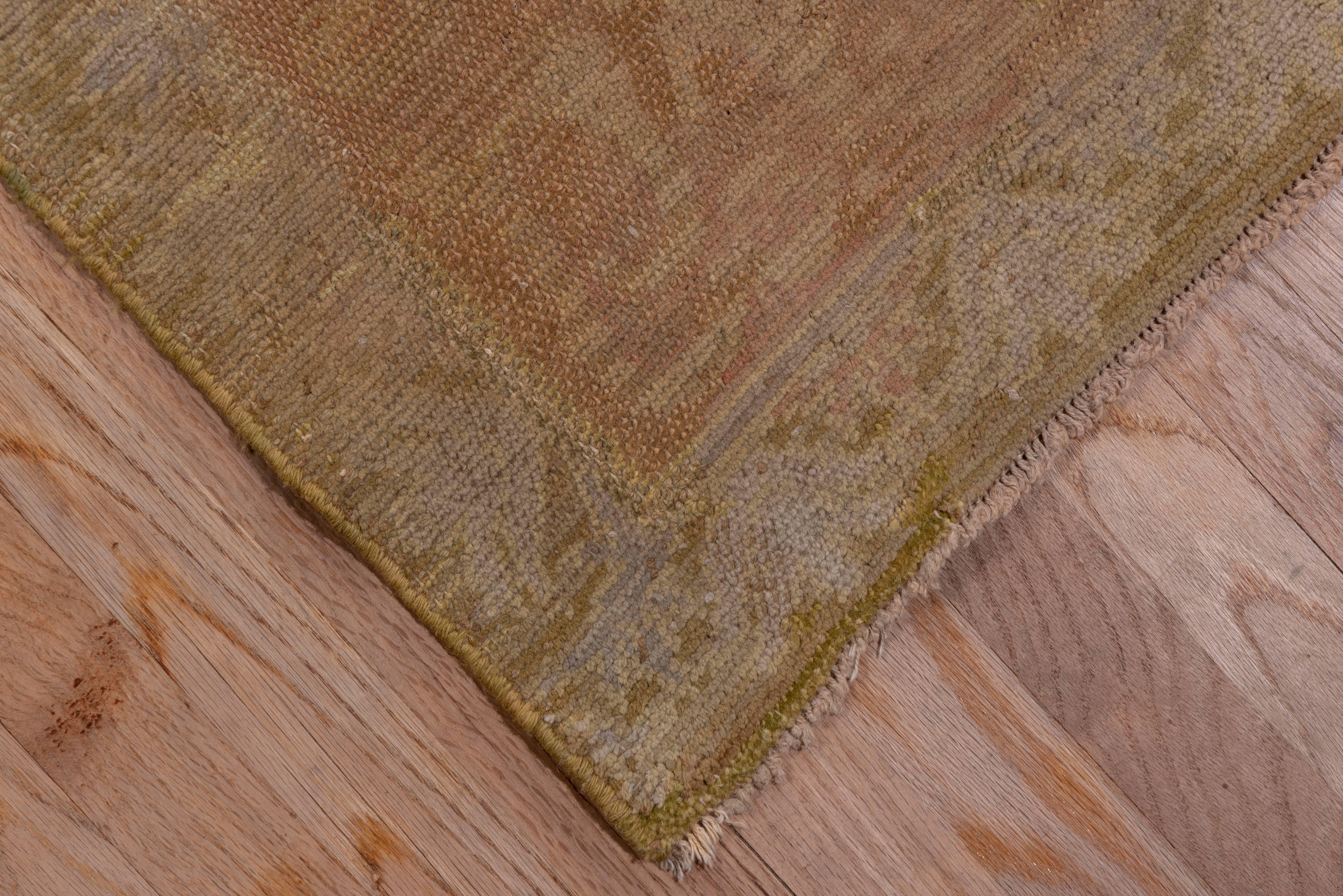 Single wefted and tied with single warp knots, this tone-on-tone Cuenca carpet has a golden beige field displaying a curved tree and cartouche pattern in a light brown. The neutral effect continues with the main border in quasi-Islamic script. Only
