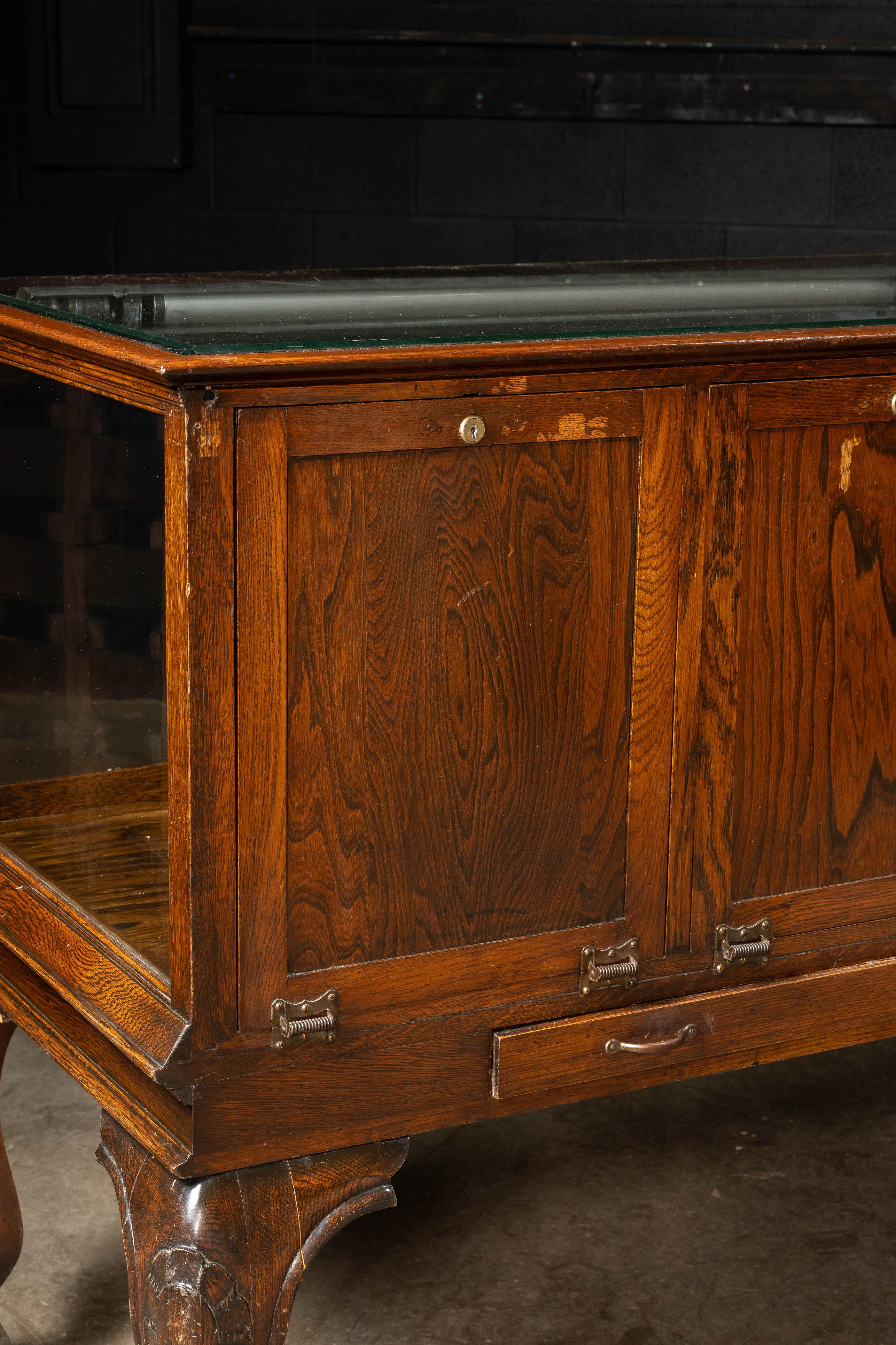 Early 20th Century Curved Glass Lighted Corner Display Case For Sale 8