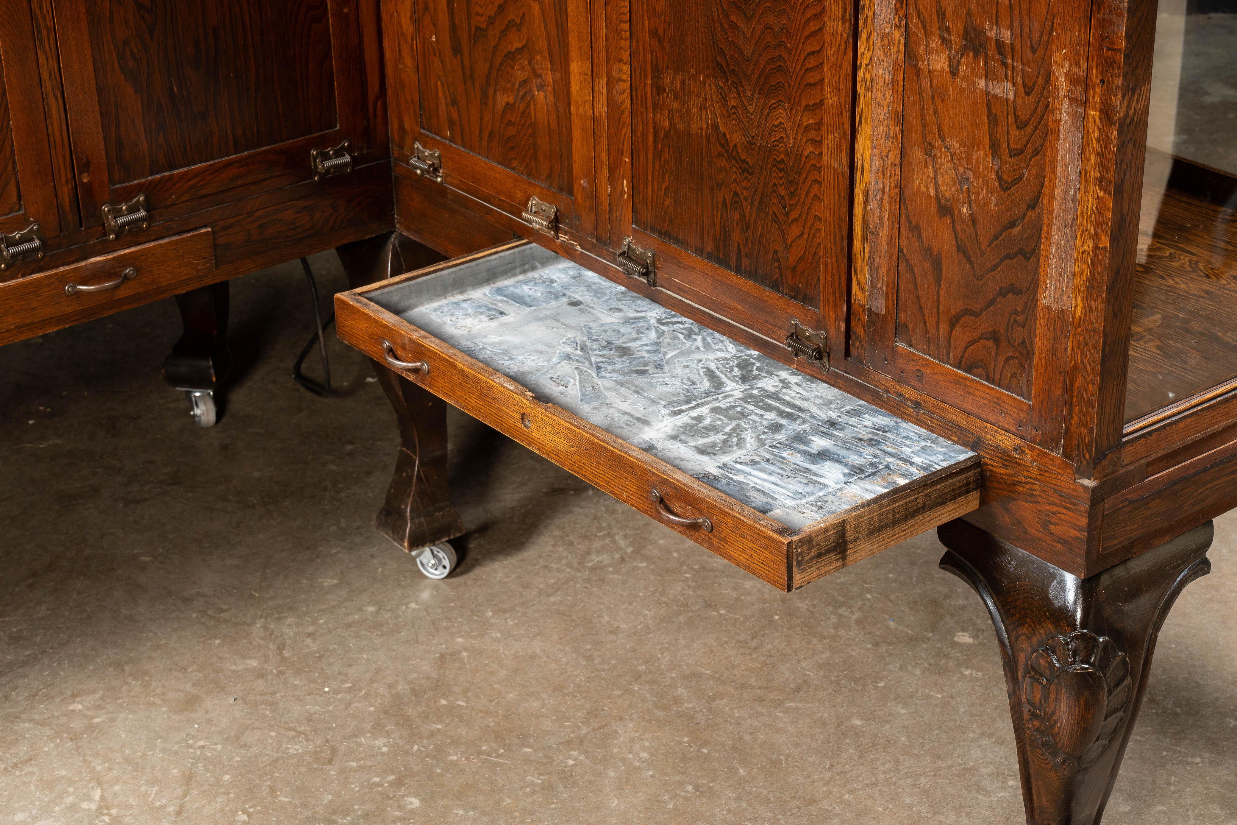 Early 20th Century Curved Glass Lighted Corner Display Case For Sale 10