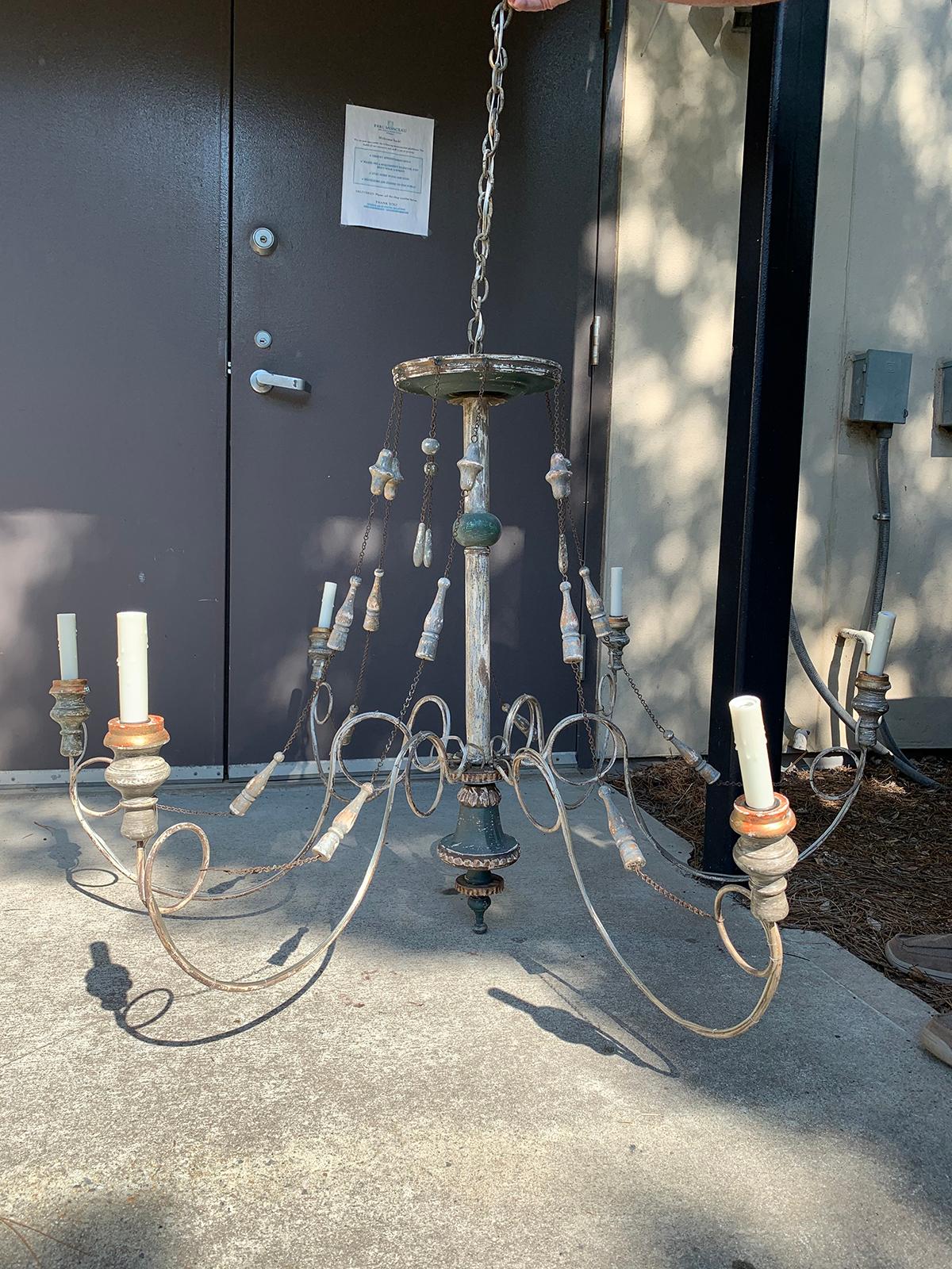 Early 20th century custom painted wood, iron, tole six-arm chandelier with tassels
New wiring.