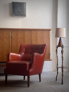 Early 20th century danish pedestal in cast bronze with botanical decor elements.