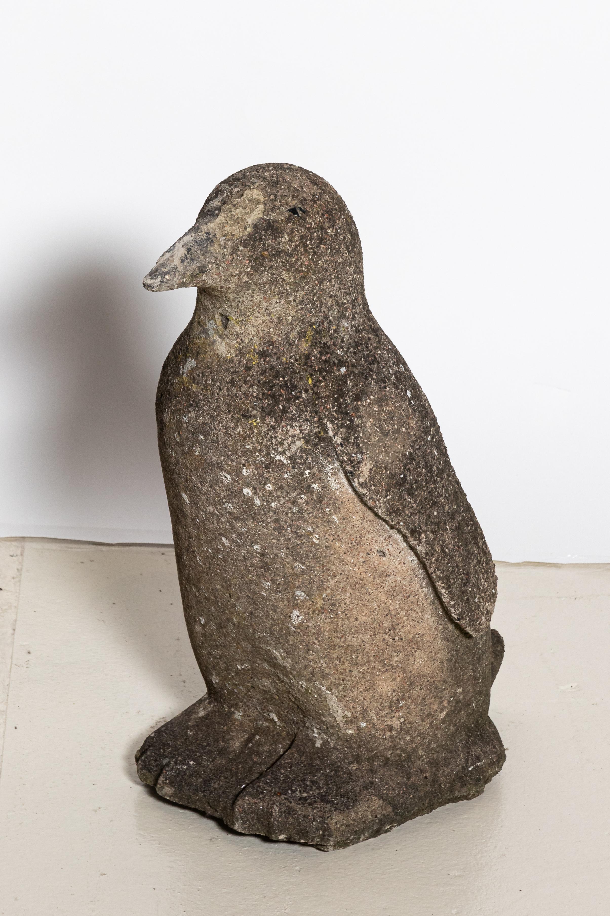 Early 20th century decorative cast stone penguin statue. Made in the United Kingdom. Please note of wear consistent with age including wear and weathering due to exposure to the elements.