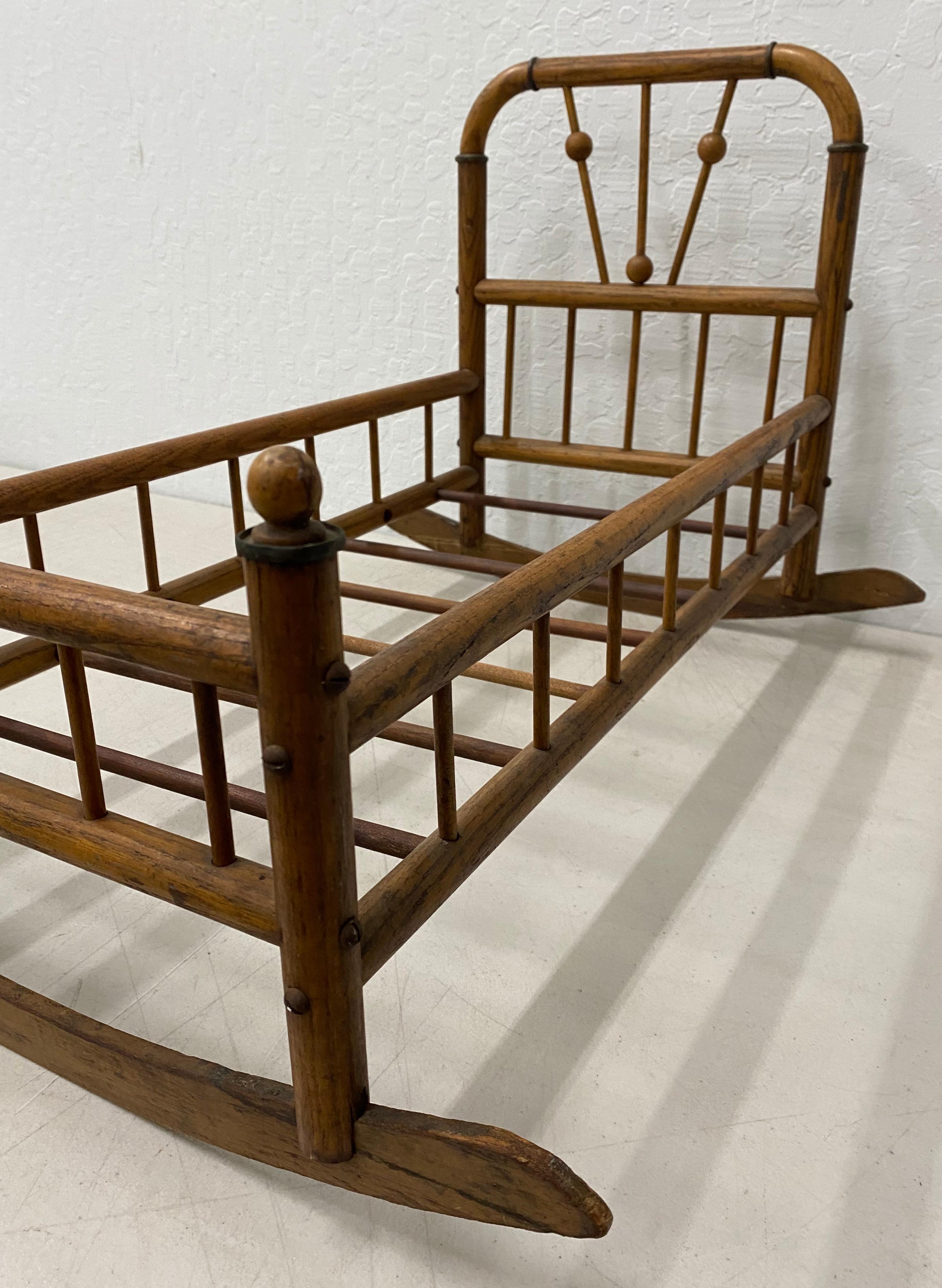 antique wooden doll bed