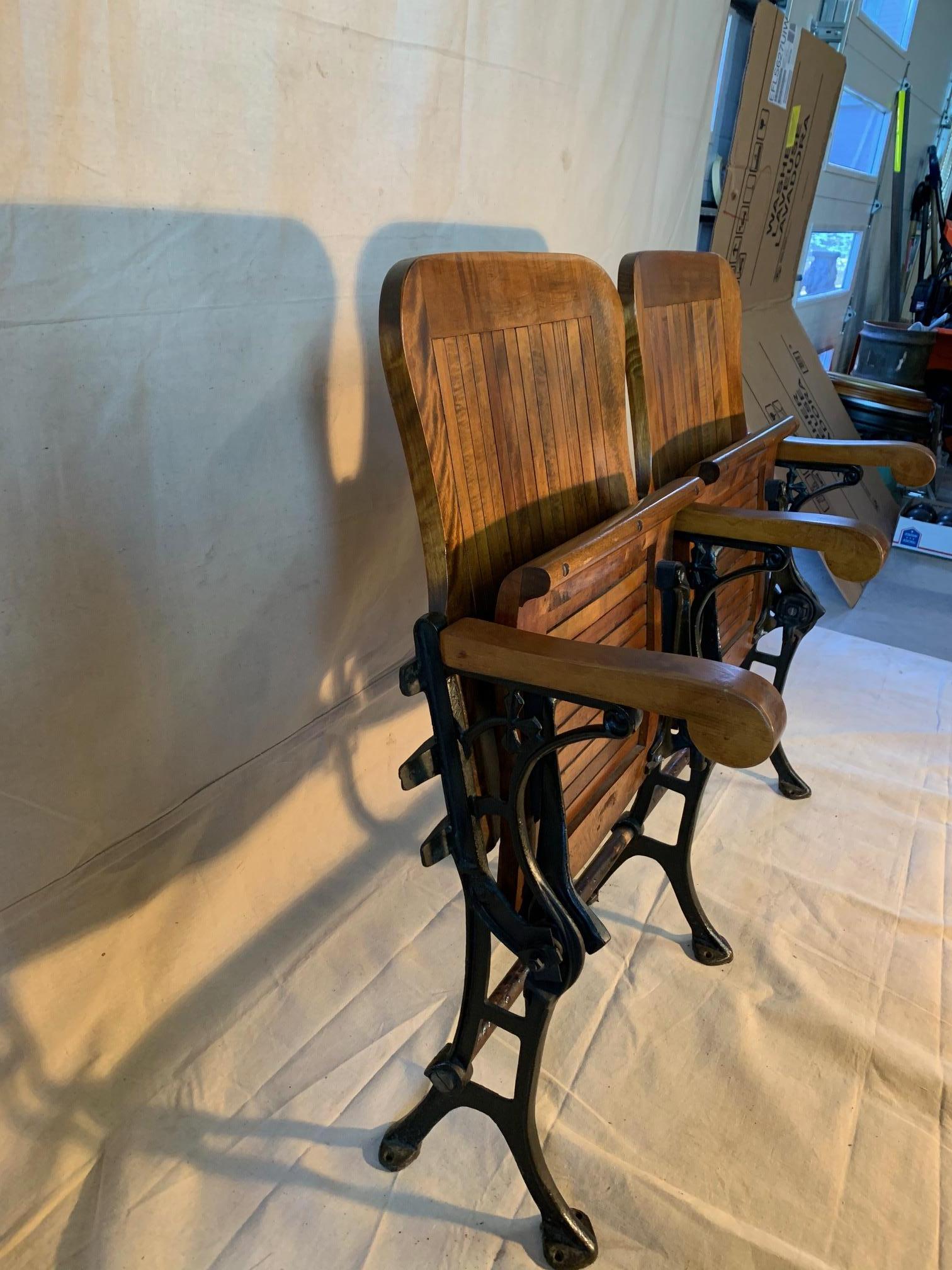 Salvaged from Brooklyn, NY, this pair of connected wooden folding chairs are
well preserved and beautifully finished. Overall length of the two seats
measures: 40.
         