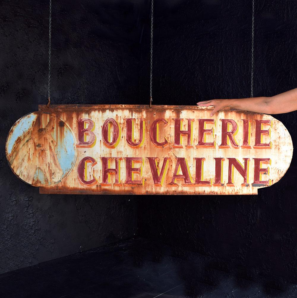 Early 20th century double sided french butchers trade sign 
We are proud to offer a rare hand-crafted metal double sided French butchers trade sign. Hand painted surface with its original 3 metal hanging hooks still in place. In completely original
