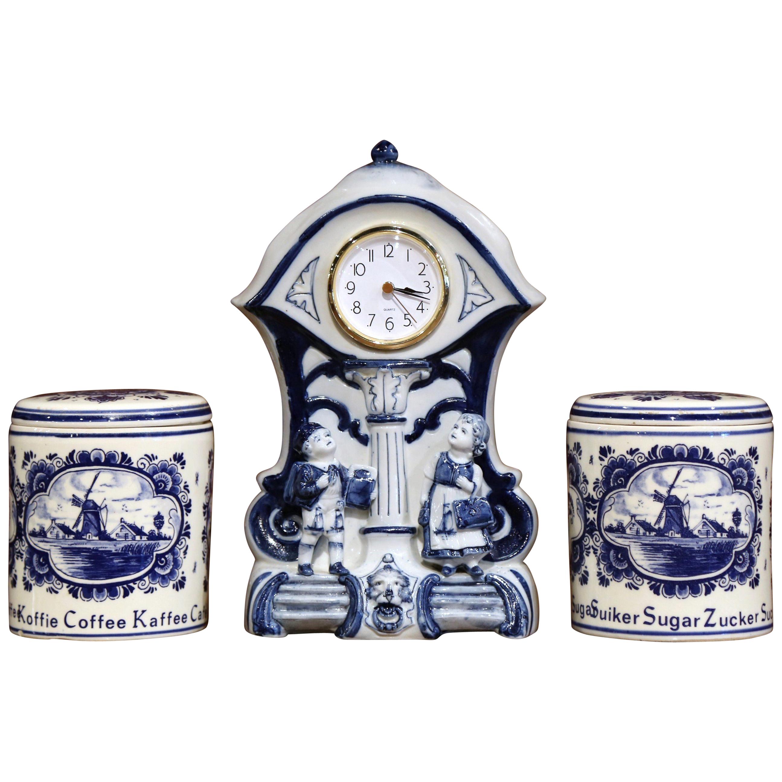 Early 20th Century Dutch and German Three-Piece Delft Canisters and Clock