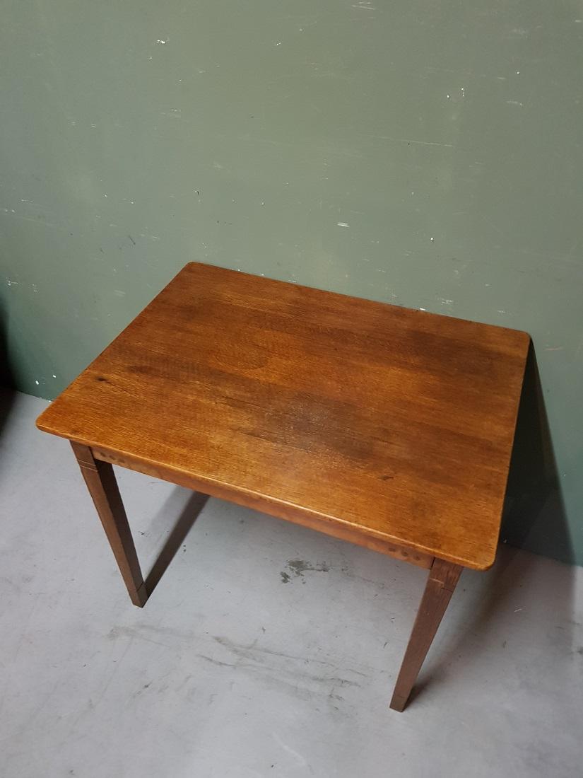 Dutch Art Deco oak table made by Firma Pander and Son The Hague Amsterdam, this is in a good condition with some user marks. Originating from the first half of the 20th century.

The measurements are,
Depth 60 cm/ 23.6 inch.
Width 80 cm/ 31.4