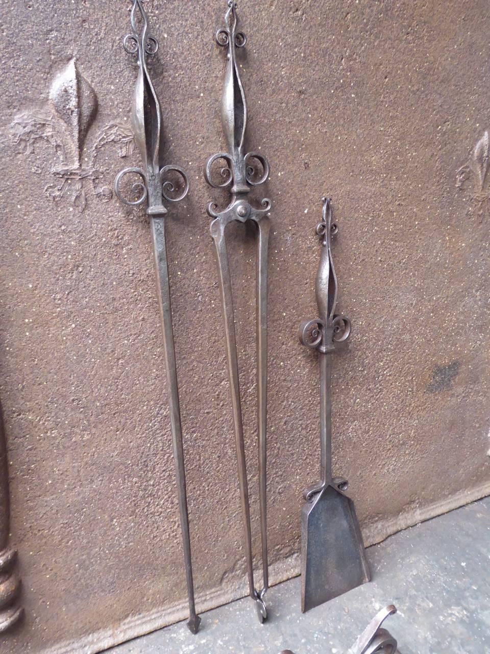 Early 20th century Dutch Art Nouveau fireplace tool set - fire irons made of wrought iron.

We have a unique and specialized collection of antique and used fireplace accessories consisting of more than 1000 listings at 1stdibs. Amongst others we