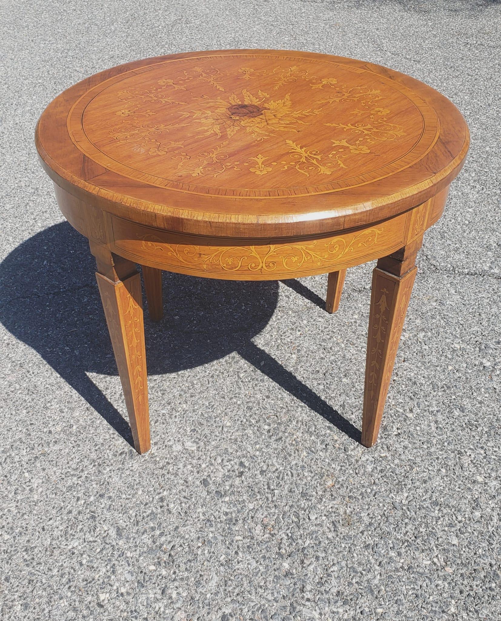 An Early 20th century Dutch Colonial Style Marquetry mixed Fruitwoods Gueridon Table in good antique condition. 
fine Marquetry work throught the top and and all legs. Measures 25